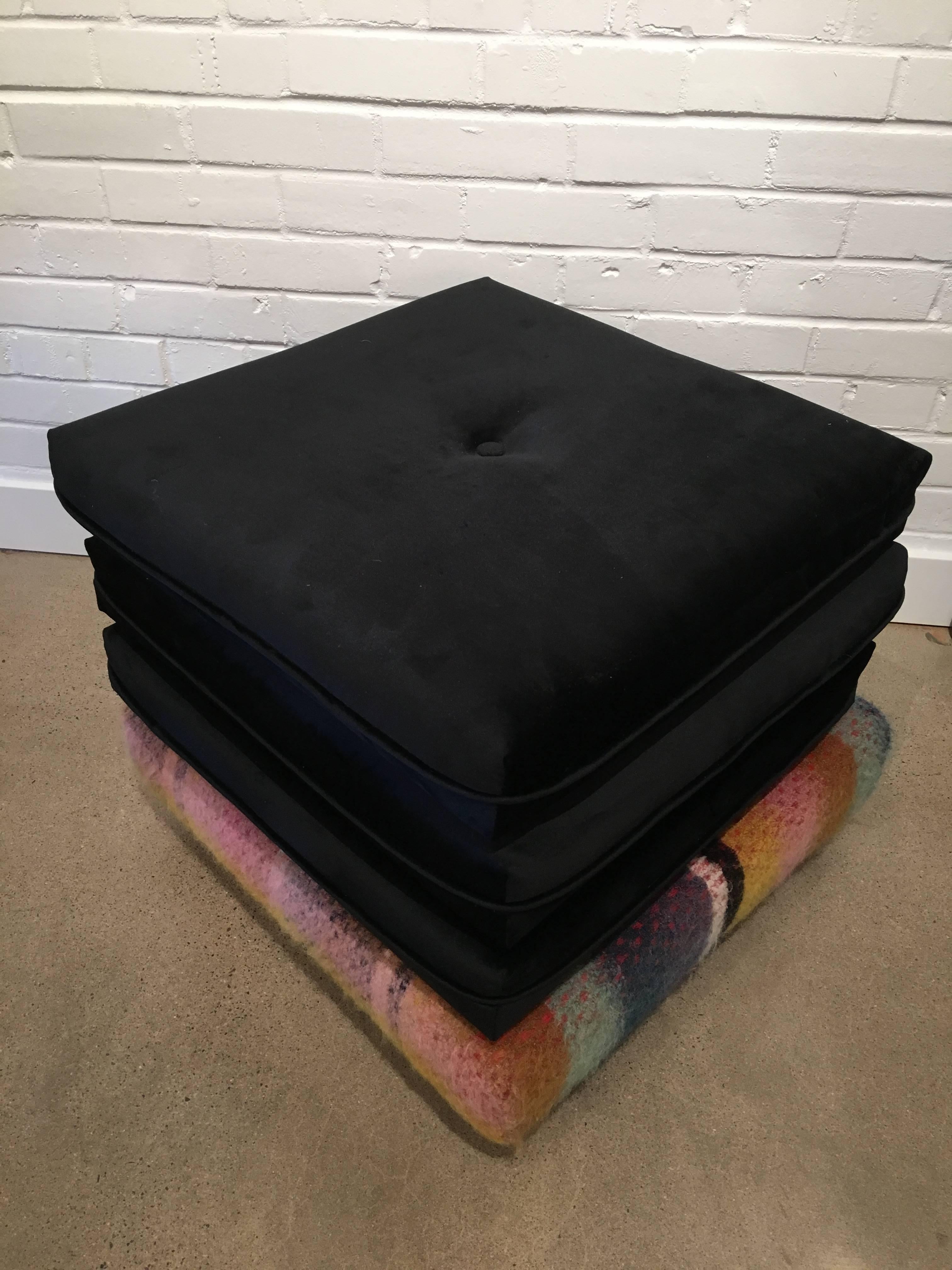 These vintage beauties have just been reupholstered in Clarence House black sueded cotton with the base (on wheels) upholstered in a new Pierre Frey multicolored wool plaid. The pillows can be removed and used as floor cushions for a chic and