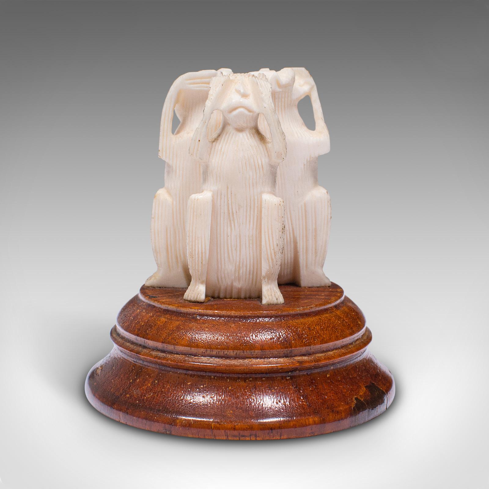 This is a vintage three wise monkeys figure. A Japanese, bone and elm ornament, dating to the late Art Deco period, circa 1940.

Charming figure of the proverbial 'See No Evil, Hear No Evil, Speak no Evil'
Displays a desirable aged patina