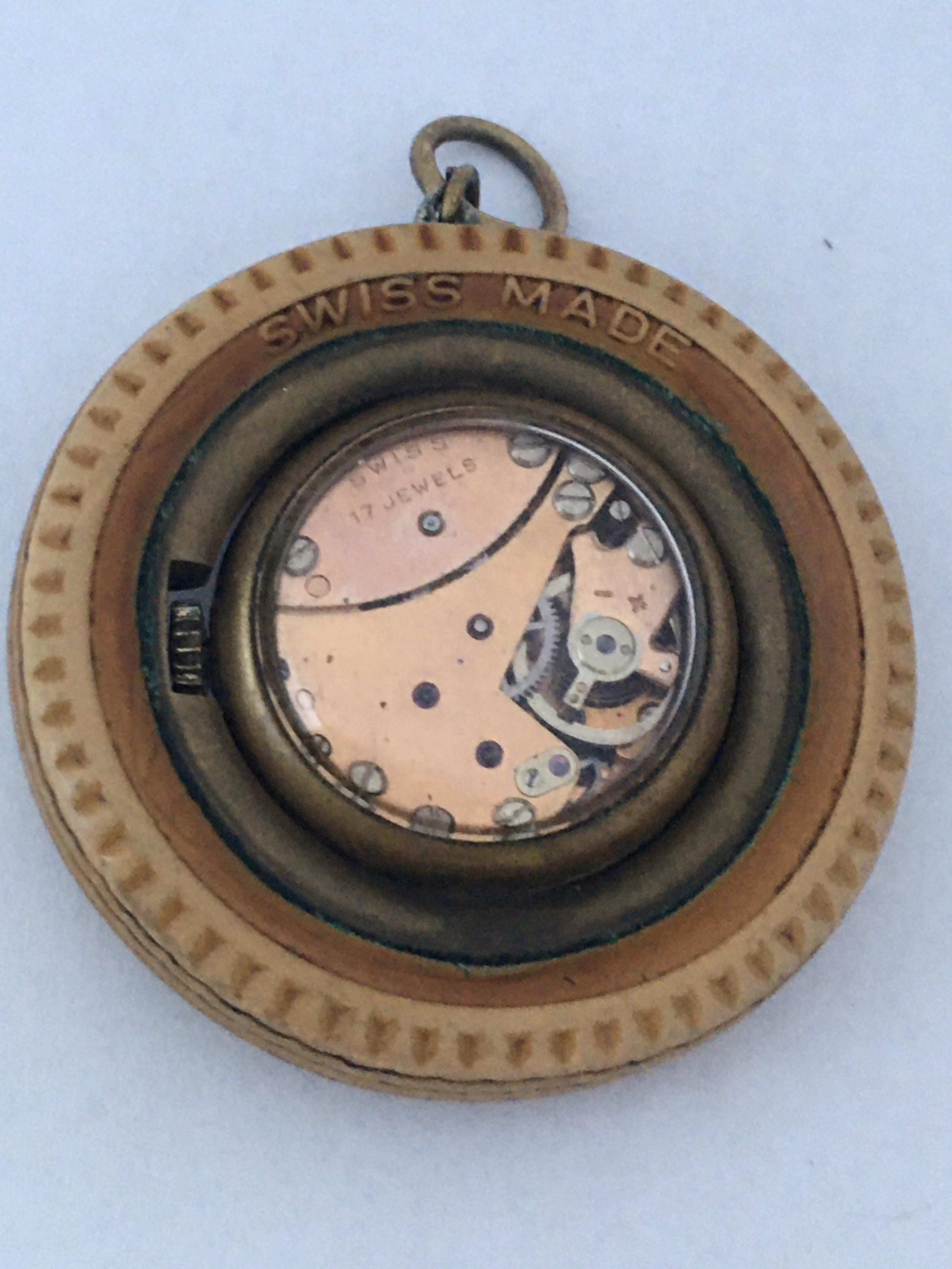 This beautiful vintage hand winding pendant watch is in good working condition and it is running. Visible signs of ageing and wear as shown. 

Please study the images carefully as form part of the description.