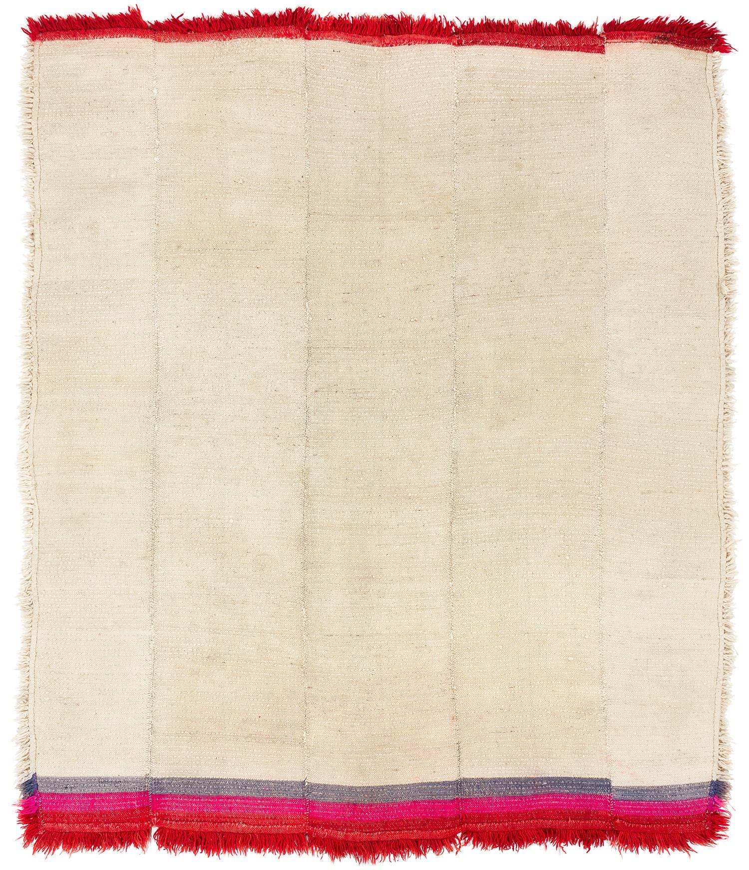 This hand-loomed Tibetan wool blanket is a rare vintage piece. Its thick pile would have been used for sleeping on or under during the cold nights in the Himalayas. In Tibet, it would also have been draped around the shoulders as a blanket. Today,