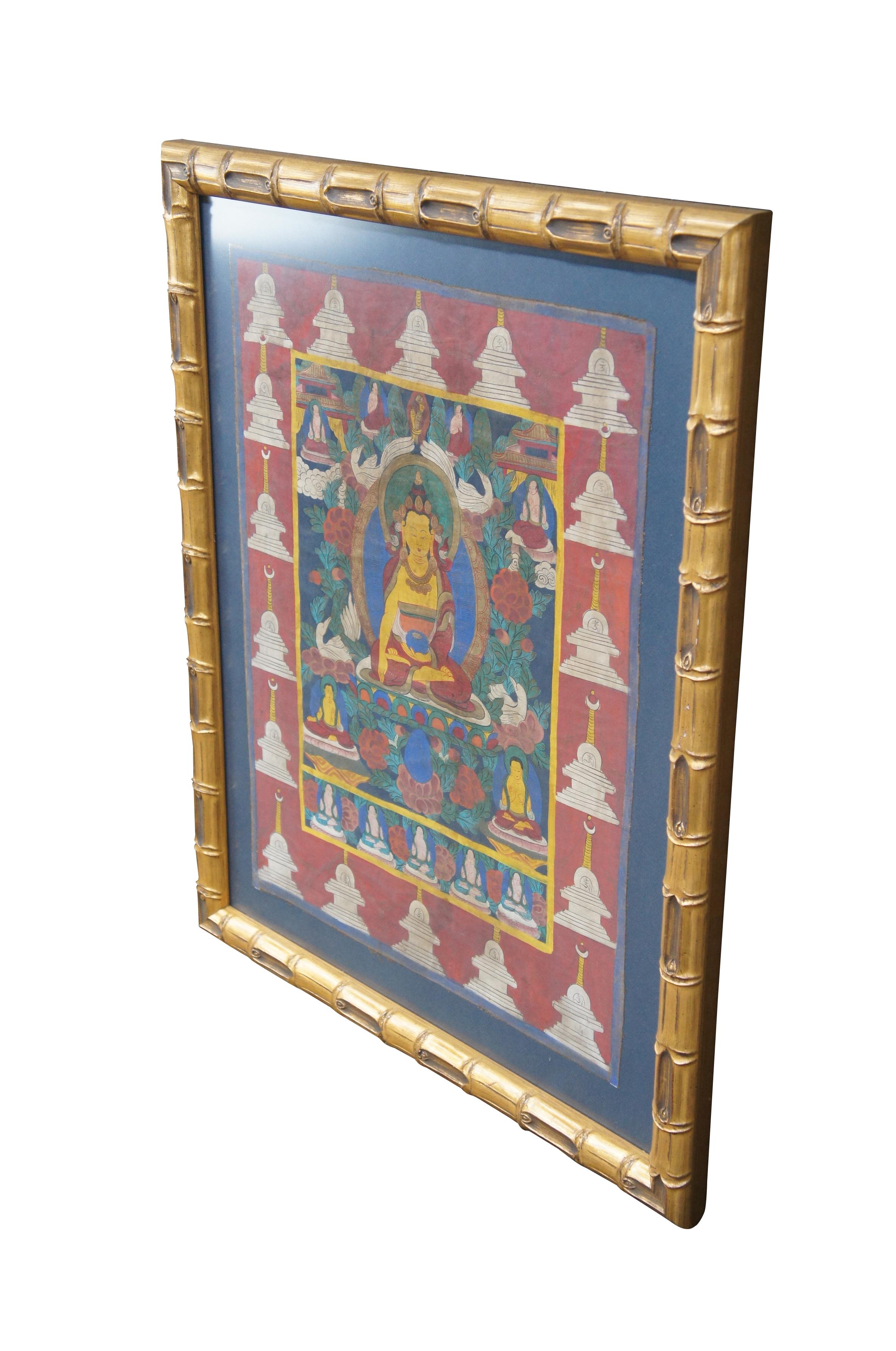 Hand Painted Tibetan Thangka from the last half of the 20th century.  Features a central buddha surrounded by foliate, flowers, whooper swans and smaller buddha figures.  The border is framed in  Stupa's (Pagodas).  Framed in wood with raised faux