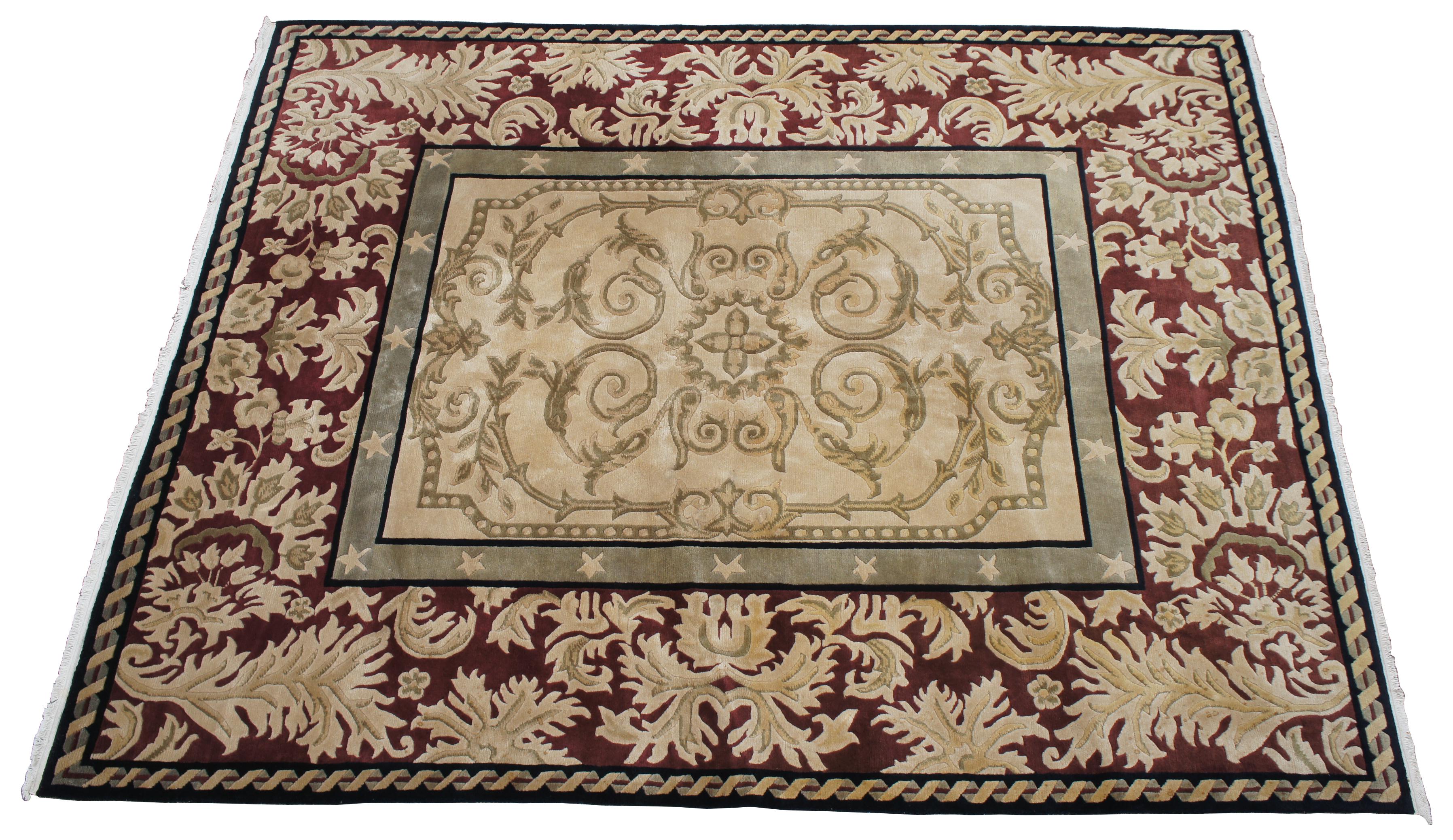 Vintage Indo Nepal Tibetan area rug. Features a rectangular medallion with stars over a red / maroon field, with beige / gold / tan, olive green and braided boarder with black accents. Measures: 8' x 10'.
      