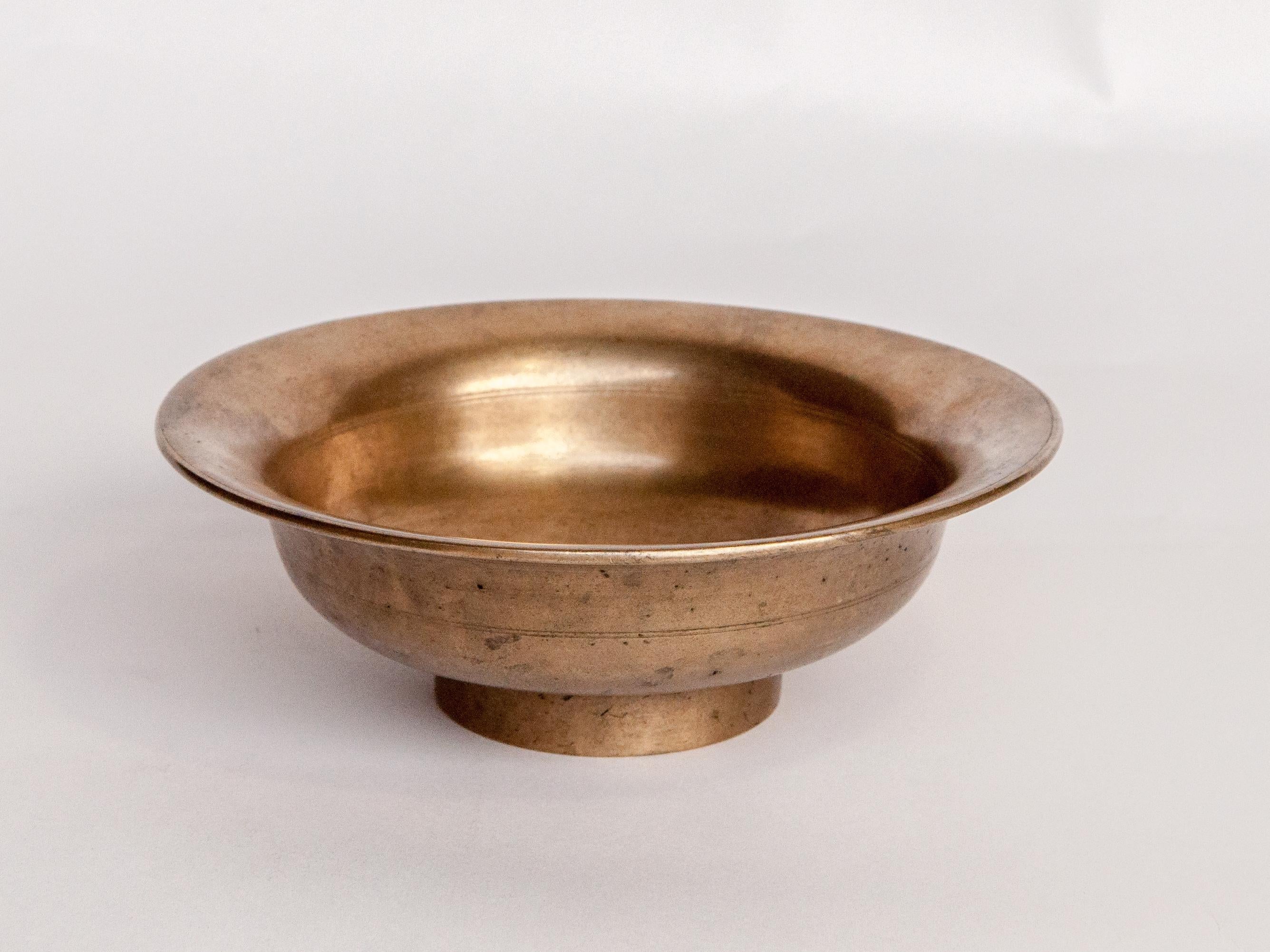 Vintage Tibetan / Nepali Tsampa bowl, bronze. From Nepal, early to mid-20th century.
Tsampa is a Tibetan staple found throughout Tibet as well as among the Tibetan speaking peoples of the high Himalayan valleys of the India / Nepal / Tibet