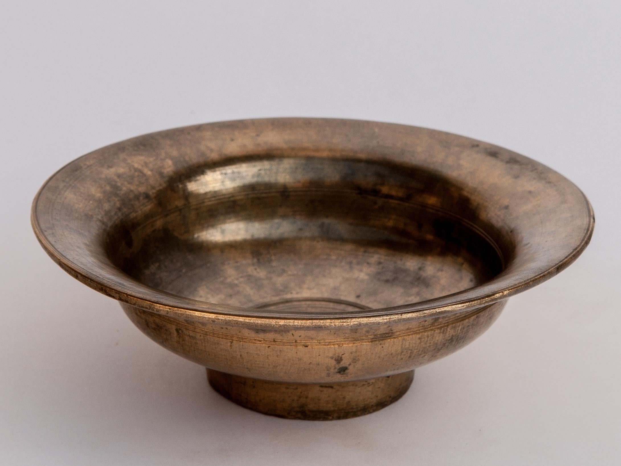 Vintage Tibetan / Nepali Tsampa bowl, bronze. From Nepal, Mid-20th century.
This bowl comes from the highlands of Nepal, along the Tibetan Nepal border where it would have been used as a food bowl for tsampa, a roasted barley flour. This particular