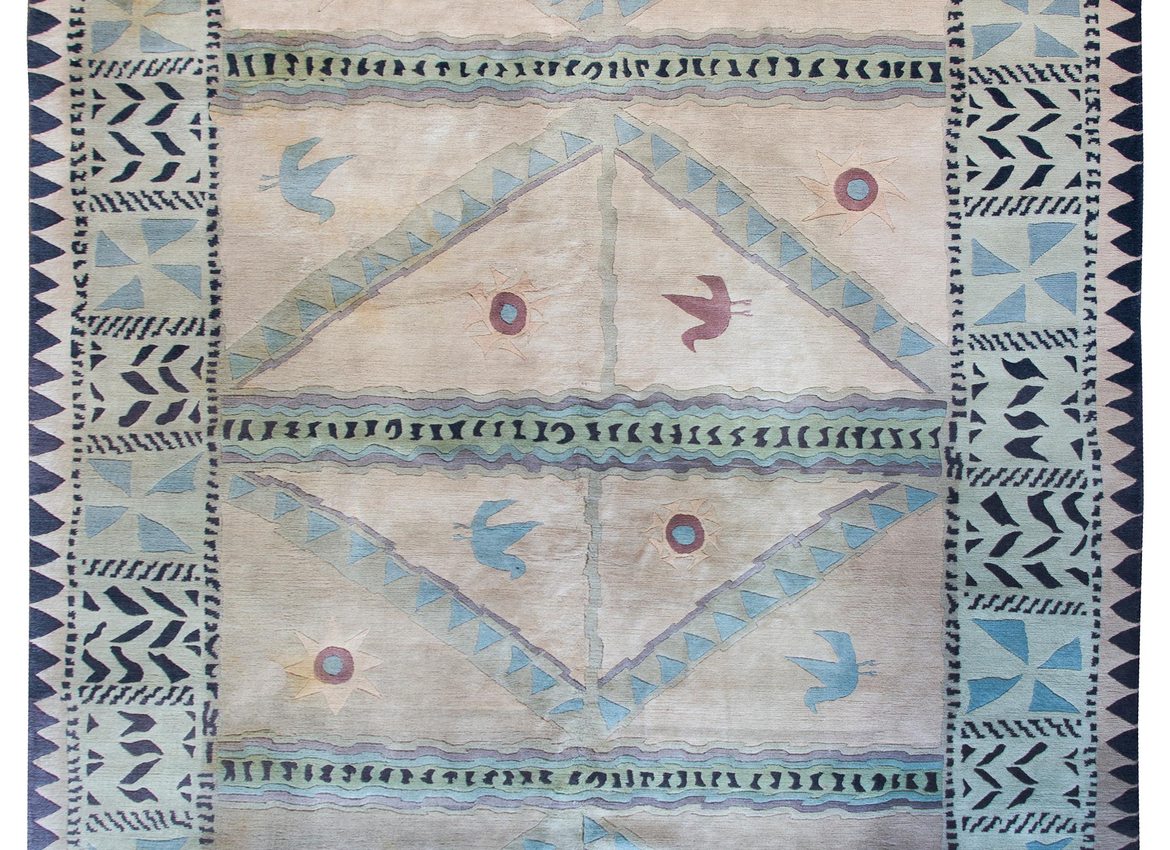 A charming and whimsical late 20th century Tibetan rug with with a highly stylized pattern with birds, suns, geometric and tiger stripes, and all woven in light blue, green, yellow, mauve, and black hand knotted wood.