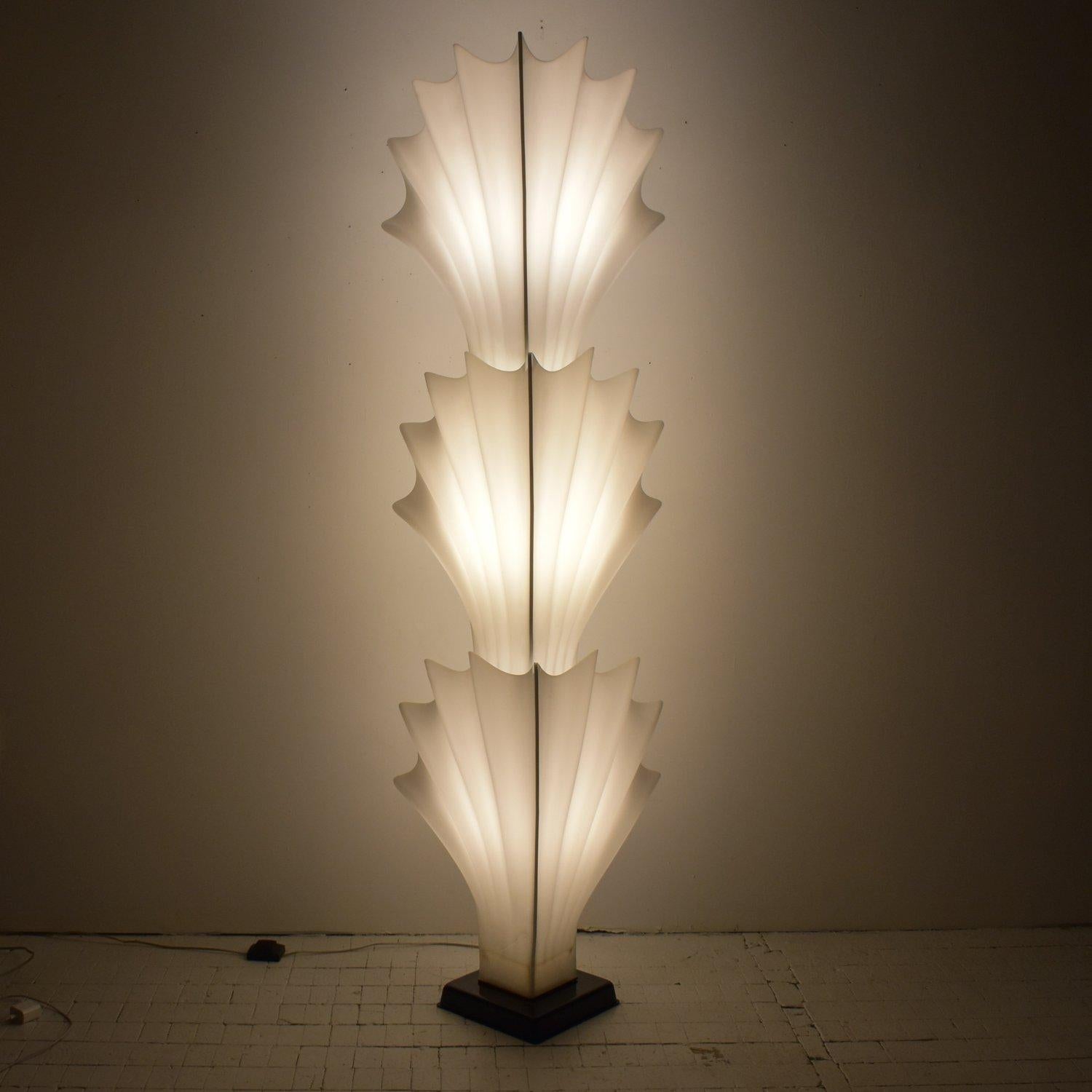 Vintage Tiered Molded Plexi Shell Floor Lamp by Roger Rougier, Circa 1970s. Monumental trompe l’oeil scalloped shell floor lamp by French-Canadian designer, Roger Rougier. Three large-scale, milky-white bifurcated plexi seashells, slightly