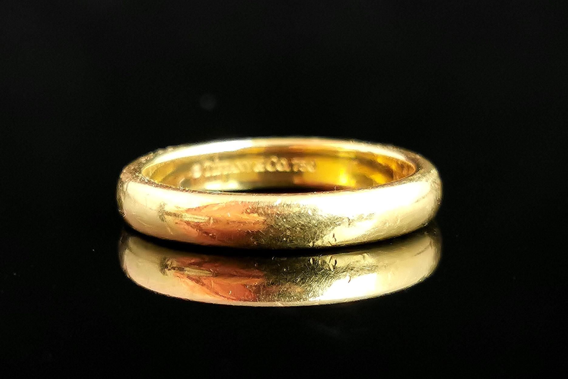 A beautiful vintage Tiffany Classic 18kt yellow gold band ring.

From the timeless Tiffany classic range, early 2000s, this beautifully crafted Lucida wedding band ring has a chunky D profile and smooth finish.

A perfect choice as a gift or wedding