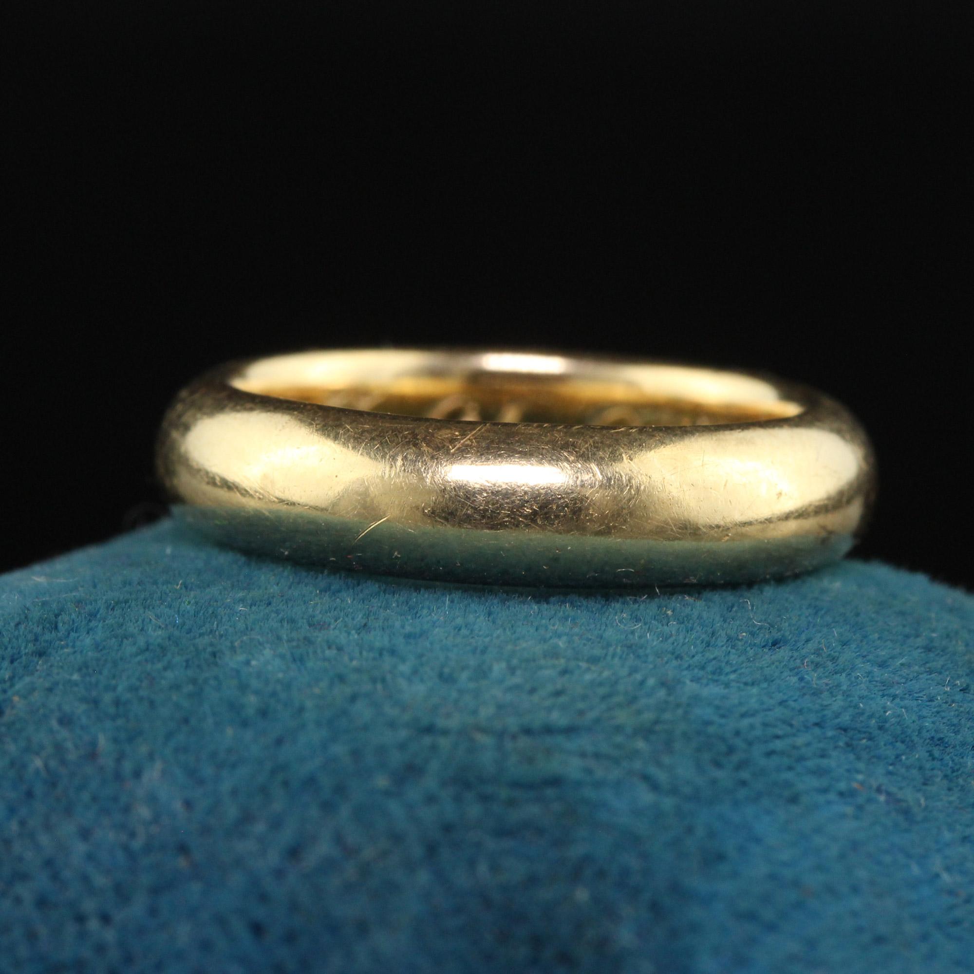 Beautiful Vintage Tiffany and Co 14K Yellow Gold Classic Wedding Band - Size 4 1/2. This classic Tiffany and Co wedding band is crafted in 14k yellow gold. The ring is engraved inside the band 
