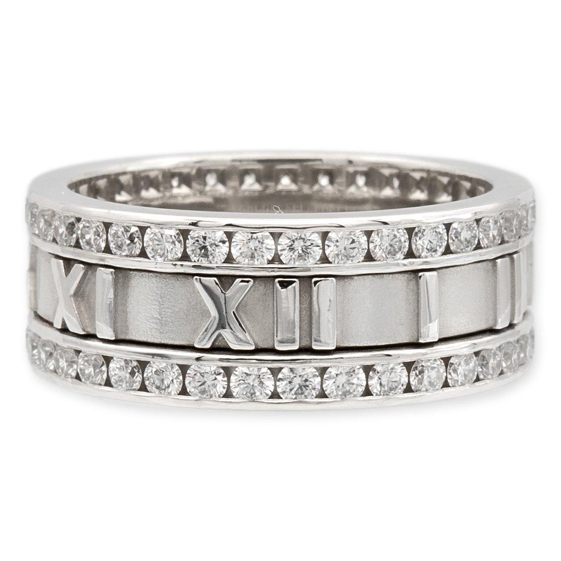 Vintage Tiffany & Co. band ring from the Atlas collection finely crafted in 18 karat white gold featuring 2 rows of round brilliant cut diamonds weighing 1.53 carats total weight G-H color and VVS-VS clarity range. The center features roman numerals