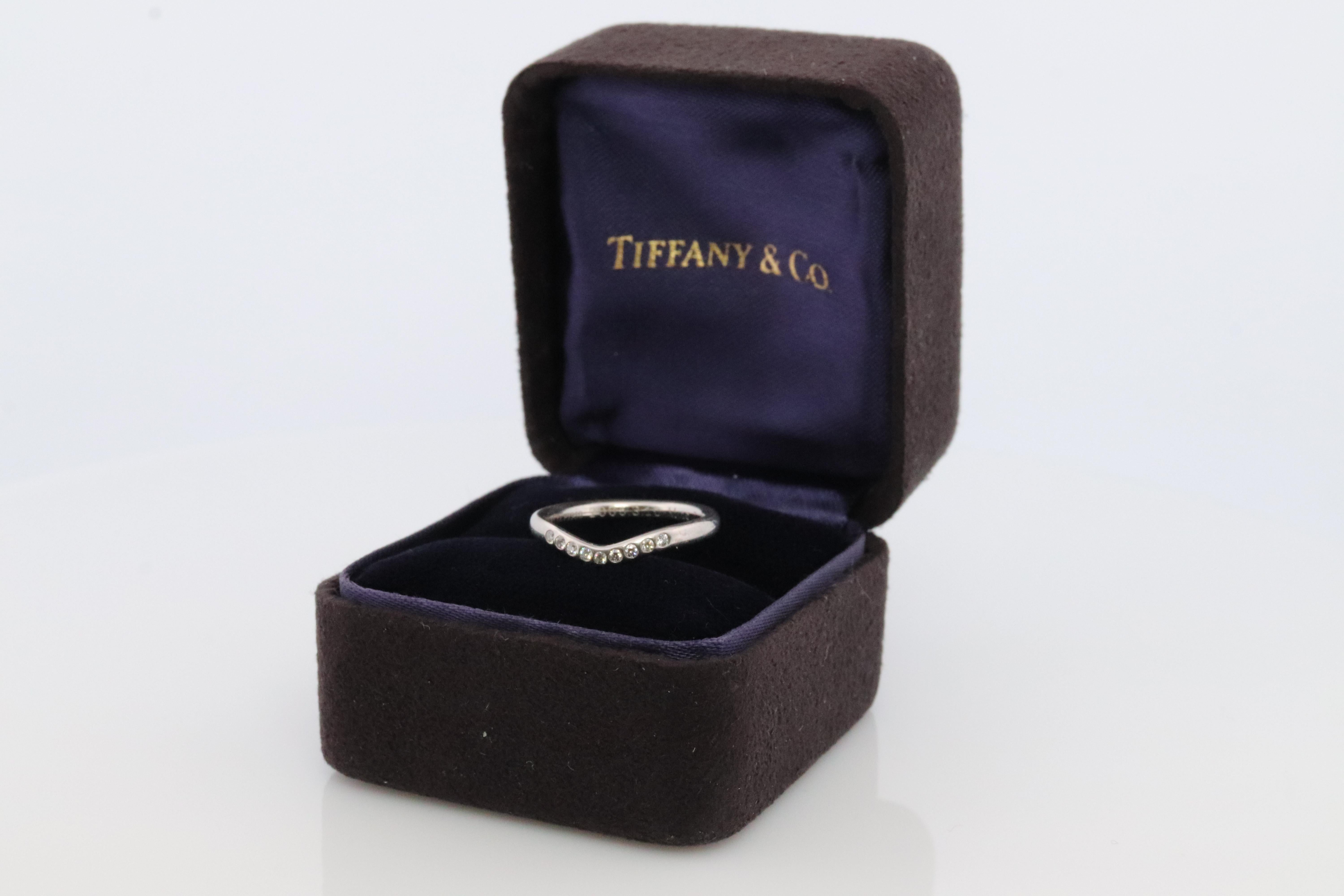 Rare Tiffany and Co. Platinum Curved Dainty ring

Diamond Eternity Bezel set into PT950.

Condition: Comes with Original Tiffany Case. Engraved 2005.3.10 M to T

Details:

Size 4.5
2.5mm wide
3 grams