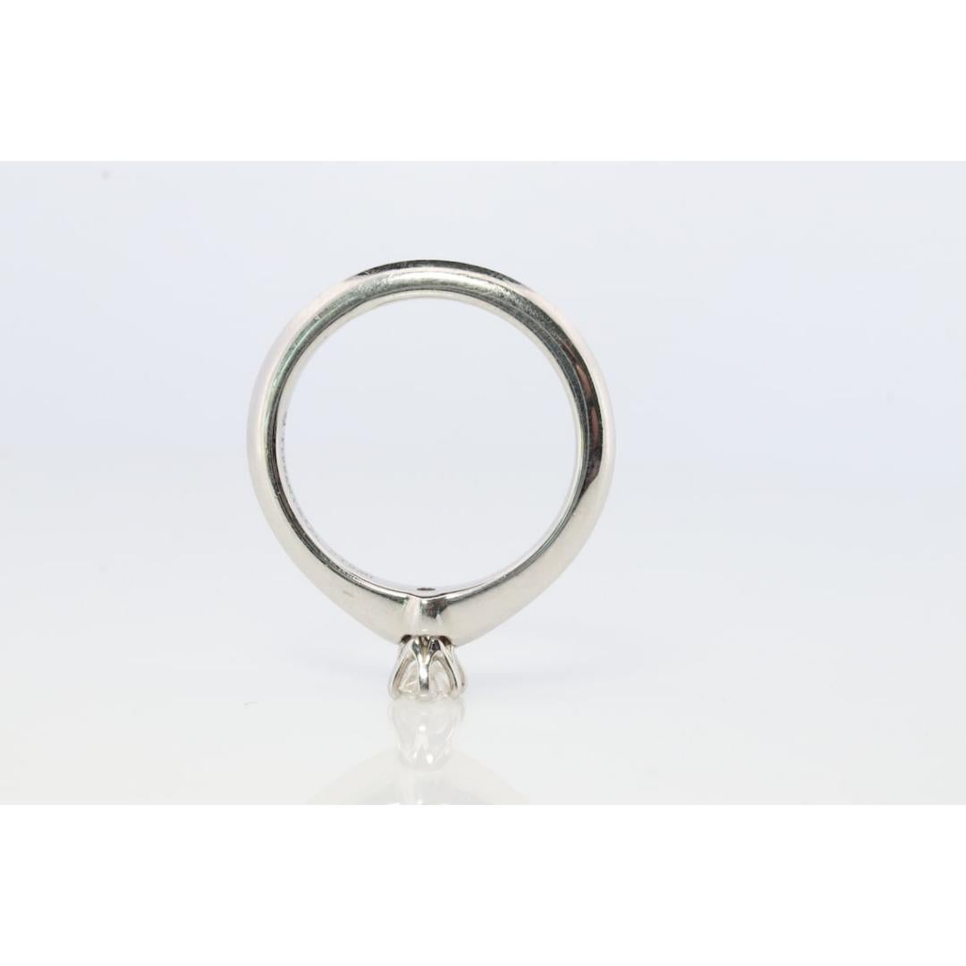 Vintage from the 1980s
Size: 4 US
Materials: Gold, Platinum
Gemstone: Diamond
Gem color: Colorless
Band color: Yellow

Style: Minimalist

Tiffany and Co. Platinum Solitaire ring

Tiffany Engagement Ring

Condition: Has not been polished. Has minimal