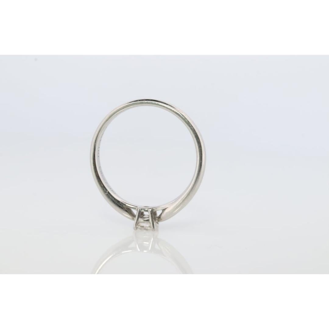 Vintage from the 1980s
Size: 4 US

Tiffany and Co. Platinum Solitaire ring

Tiffany Harmony Engagement Ring

Condition: Has not been polished. Has minimal scratching on the shank. Comes with original vintage Tiffany case.

Details:
PT950
0.19ct