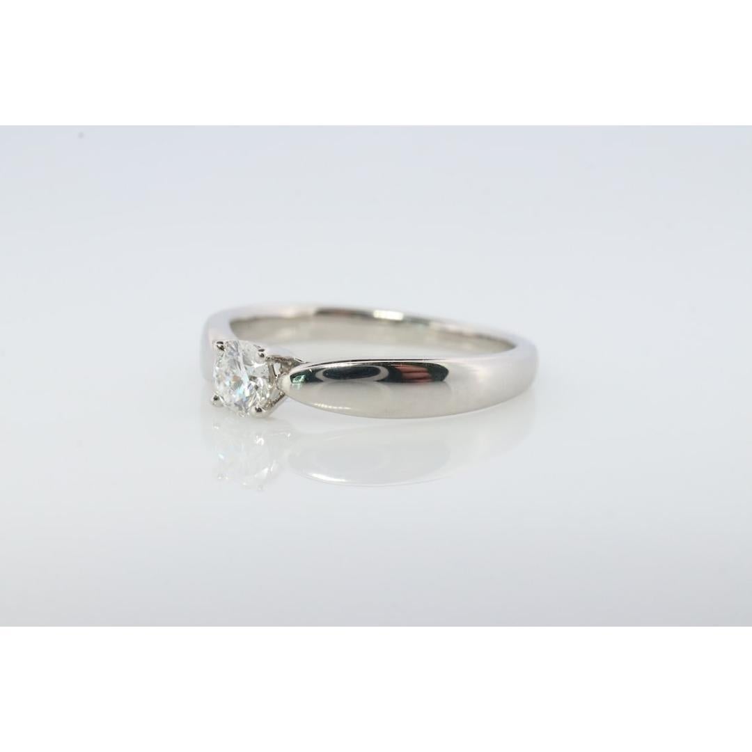 Vintage from the 1980s
Size: 4 1/4 US

Tiffany and Co. Platinum Solitaire ring

Tiffany Harmony Engagement Ring

Condition: Has not been polished. Has minimal scratching on the shank. Comes with original vintage Tiffany case.

Details:
PT950
0.19ct