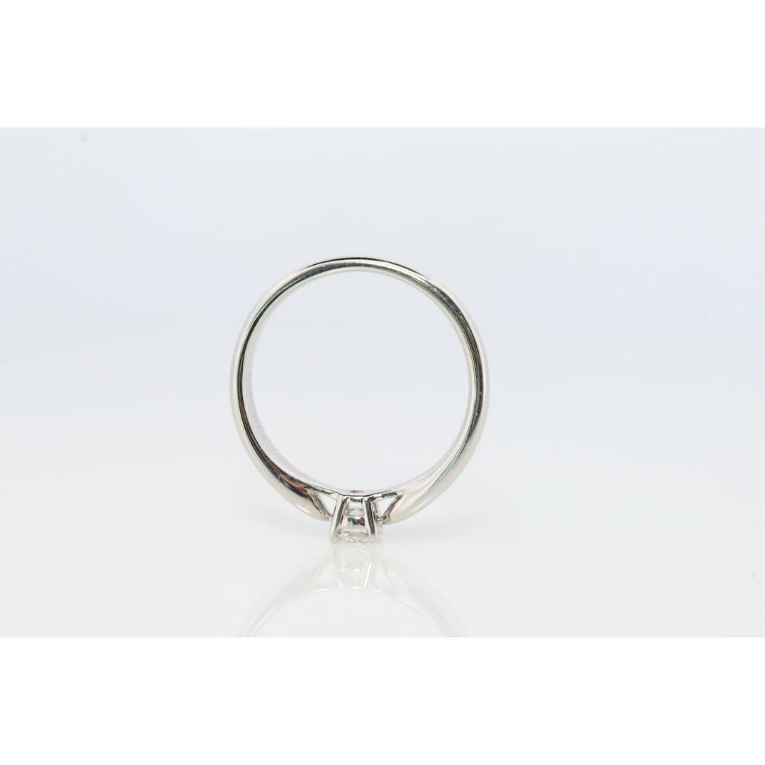 Round Cut Vintage Tiffany and Co. Diamond Ring. Authentic 0.19ct Tiffany HARMONY Platinum For Sale