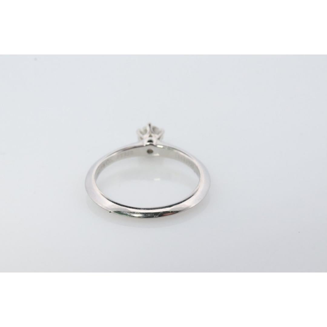 Vintage from the 1980s
Size: 4 1/2 US
Materials: Gold, Platinum
Gemstone: Diamond
Gem color: Colorless

Band color: Yellow

Tiffany and Co. Platinum Solitaire ring

Tiffany Engagement Ring

Condition: Has not been polished. Has minimal scratching on