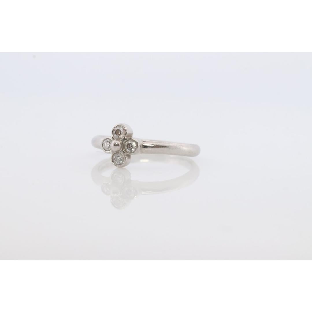 Vintage from the 1990s
Materials: Gold, Platinum
Gemstone: Diamond
Gem color: Colorless

Band color: Yellow

Rare Tiffany and Co. Platinum Dainty ring

Clover Diamond design.

Condition: Has not been polished. Has minimal scratching on the shank.