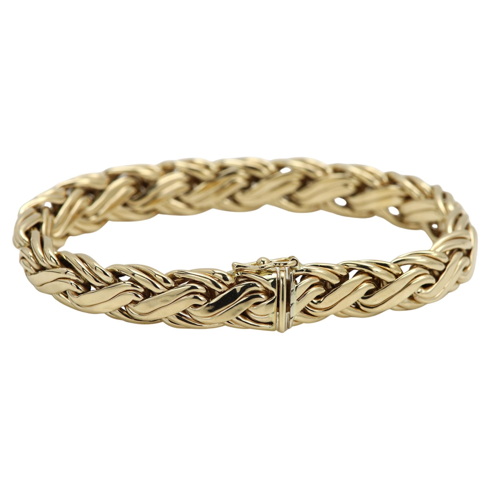 Vintage 
Bracelet authentique Tiffany & co
Or jaune 14k environ 22,80 grammes
Tampon : 585 tiffany & co
Double serrure pour plus de sécurité.
Anciennement possédé - Excellent état comme neuf.
Longueur : 7,5 pouces
+ belle boîte cadeau
Évaluation