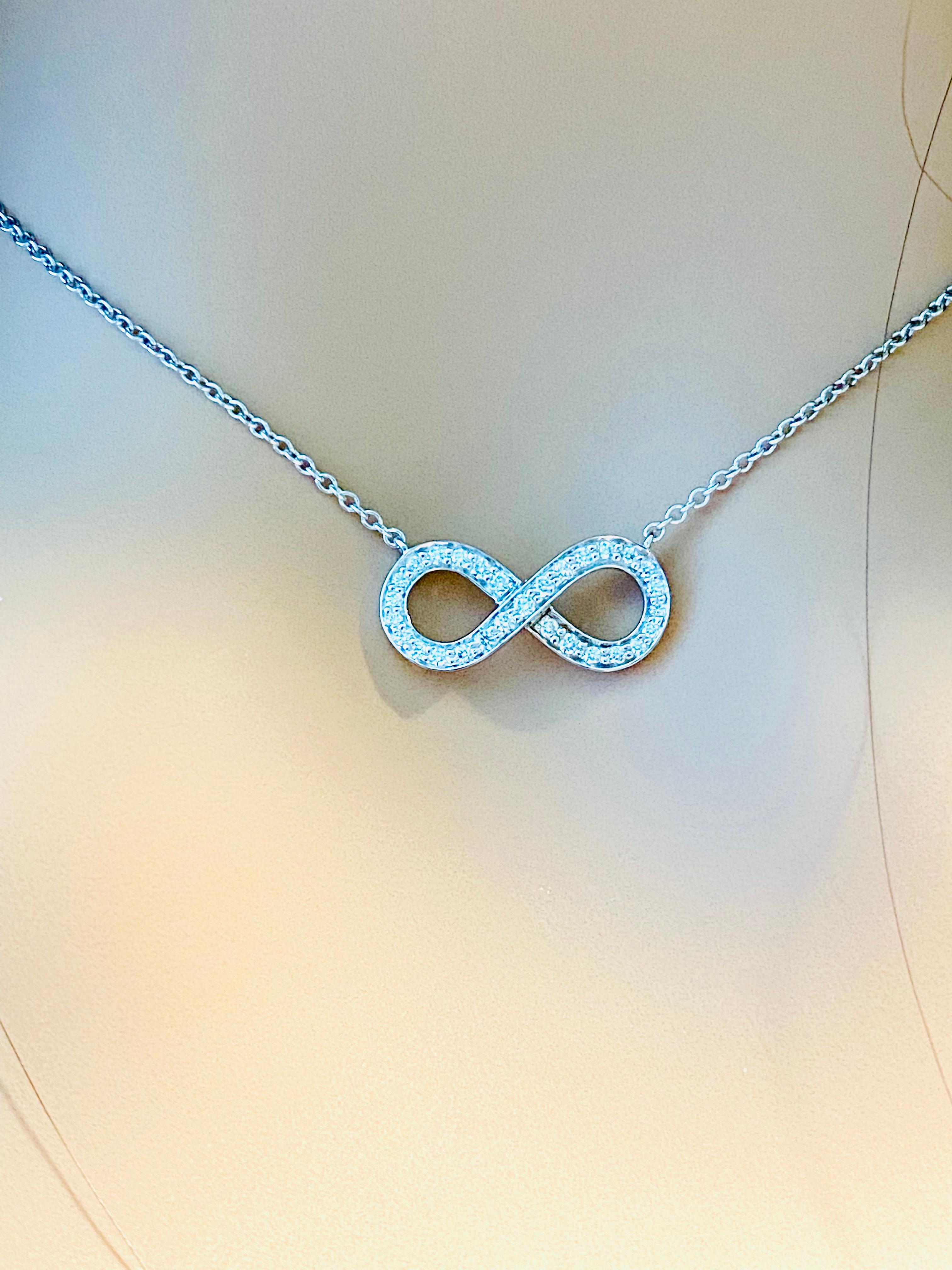 Tiffany and Co Infinity Platinum Diamond Pendant Necklace In Good Condition In New York, NY