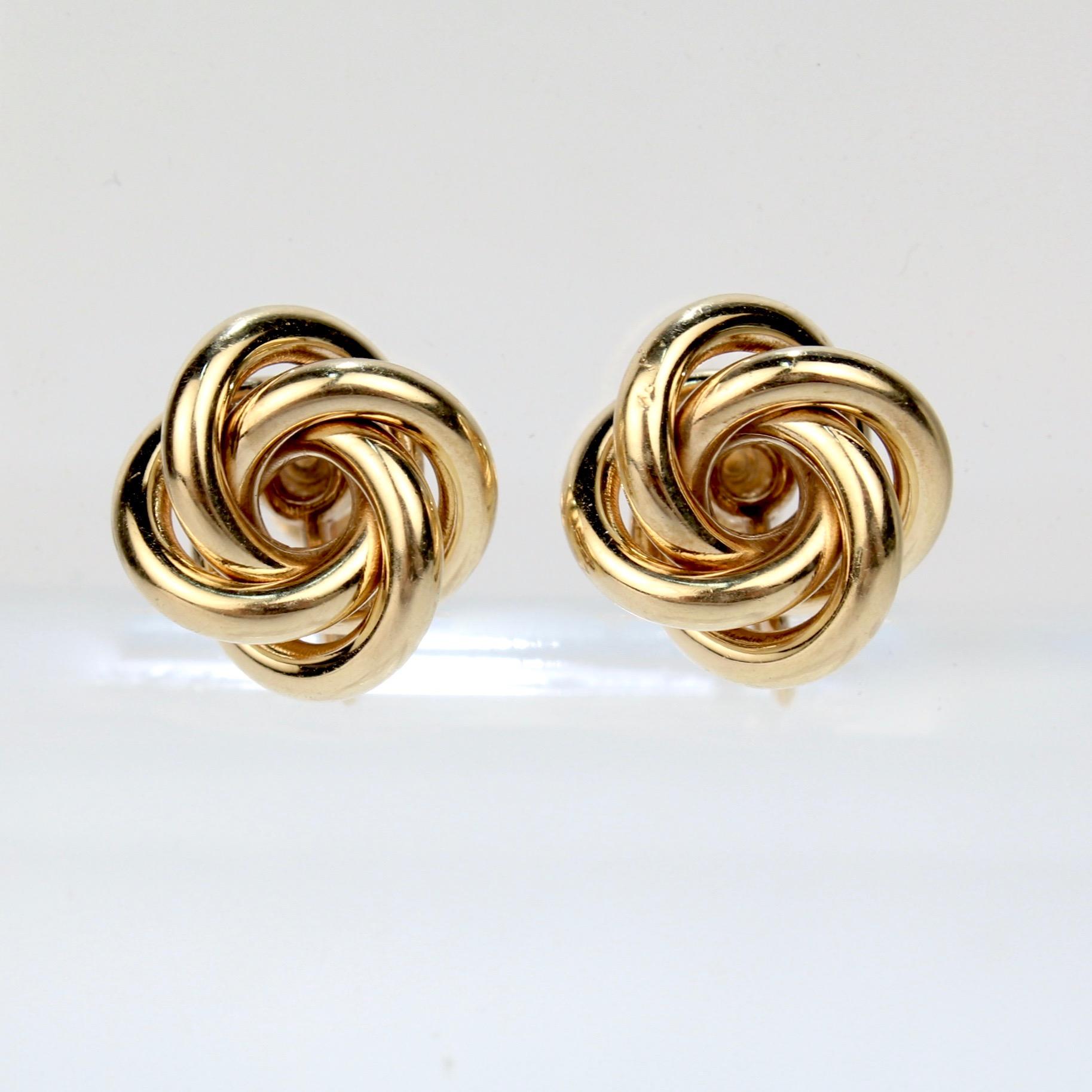 A fine pair of Tiffany & Co. Love Knot earrings.

Each in 14k gold with screw back posts.

Marked 14k and Tiffany & Co. to the reverse.

Diameter: ca. 15 mm

Items purchased from this dealer must delight you. Purchases may be returned for any reason