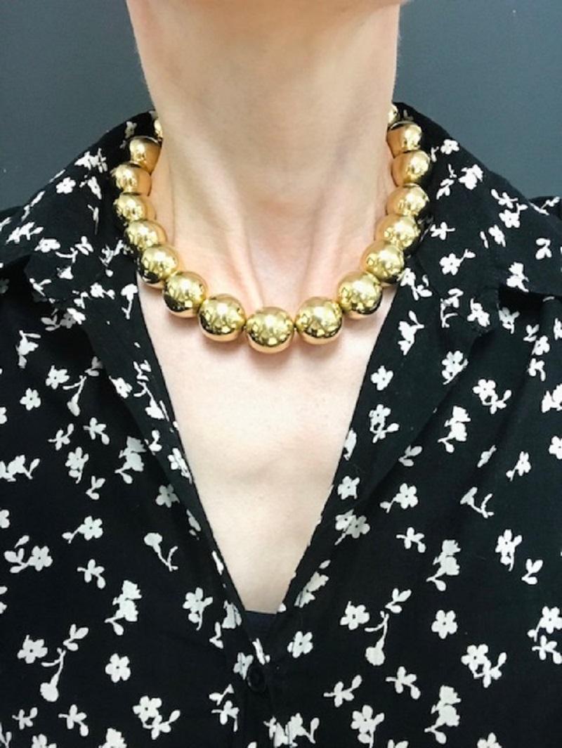 A spectacular vintage necklace by Tiffany & Co. made of 14k gold.  The beads are shiny, smooth, and large just enough to sit perfectly on a neck. 
This bold piece is full of great attitude and is certainly a show stopper.

About Tiffany & Co.