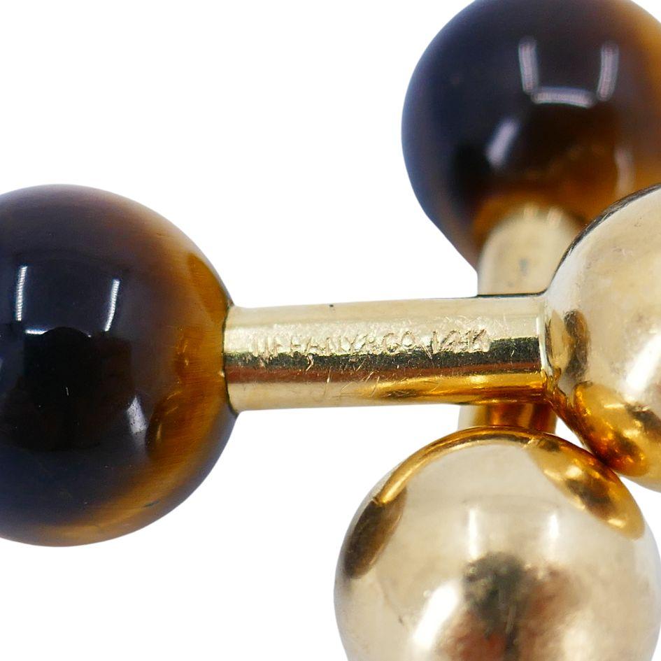 Vintage Tiffany & Co. 14k Gold Tigers Eye Cufflinks
Signed 'Tiffany & Co. 14k'
7.7 grams
Wear consistent with vintage condition