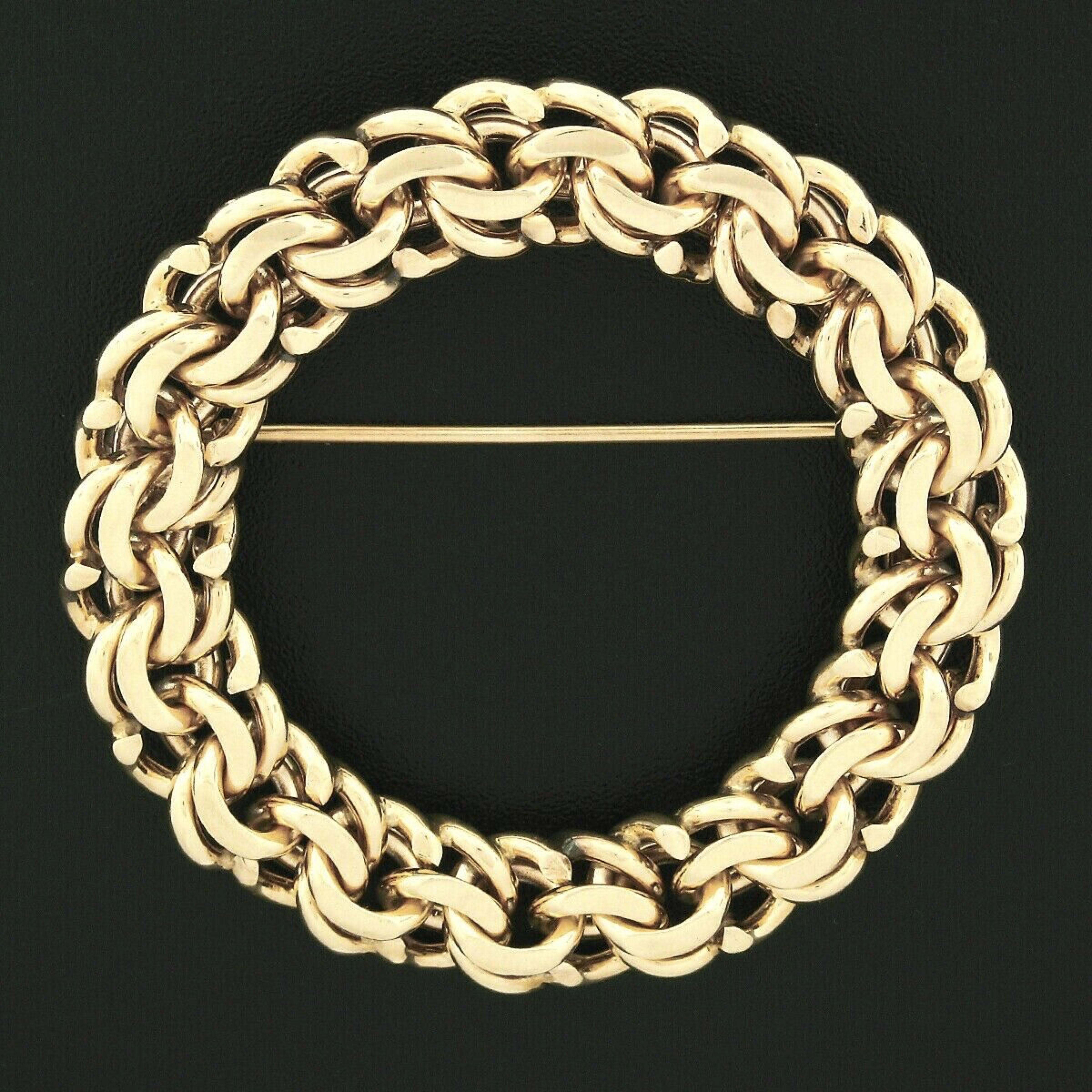 This gorgeous vintage designer brooch was crafted from solid 14k yellow gold by Tiffany & Co. The wreath style brooch features a circular multi-chain link design that is completely stationary. This lovely designer brooch is 100% authentic and