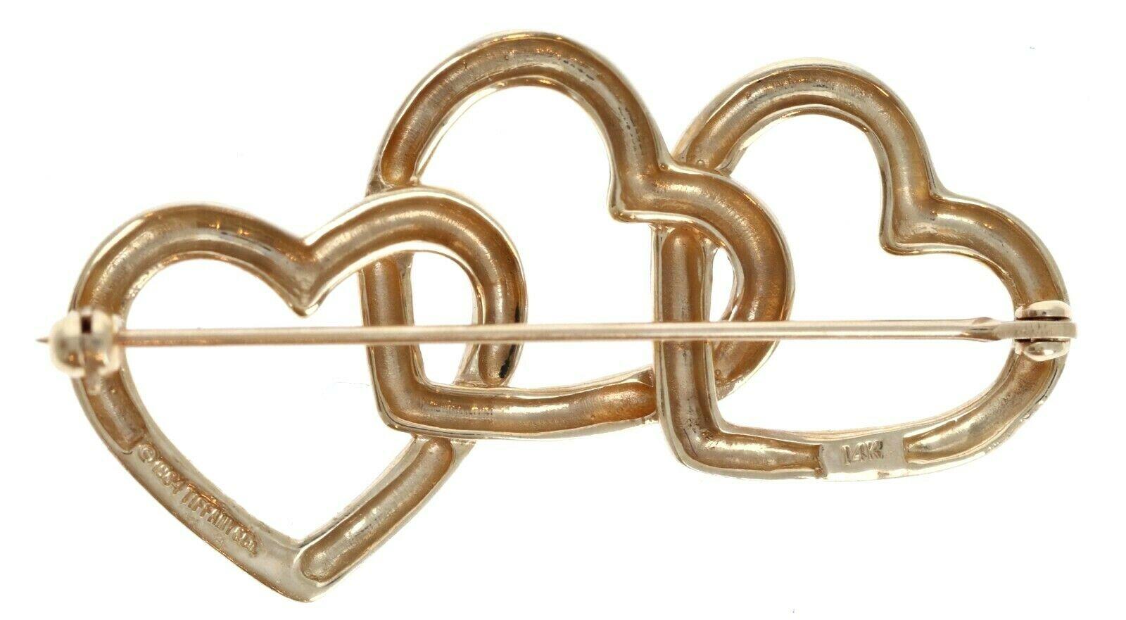 Vintage Tiffany & Co 14K Yellow Gold Triple Heart Brooch Pin 7.7g



For sale is a vintage tiffany & co 14k yellow gold heart brooch. 
The brooch is 7.7g 
Measures 43.9mm width 17.6mm Length approx.
Perfect worn day or night
Get it now! 




Brand: