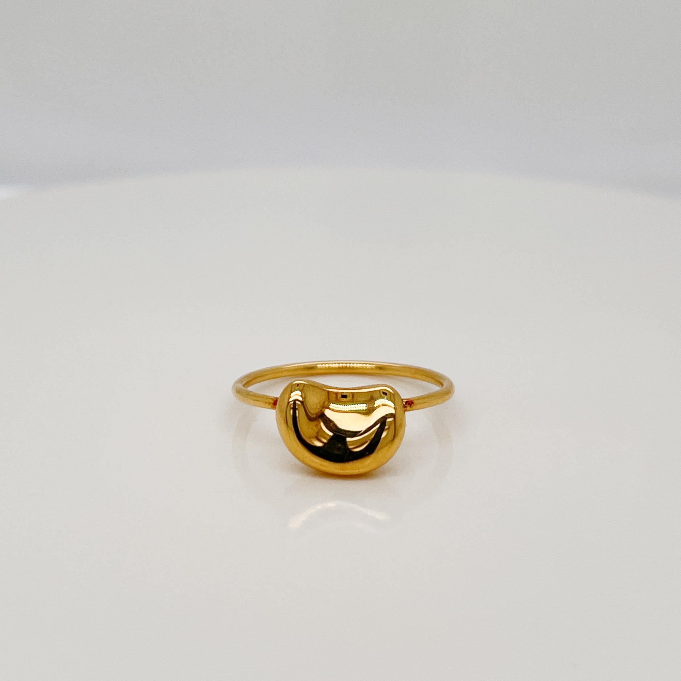 A fine Bean ring designed by Elsa Peretti.

In 18k gold.

By Tiffany & Co.

Simply a great ring by one of Tiffany's top designers!

Date:
20th Century

Overall Condition:
It is in overall good, as-pictured, used estate condition with some fine &