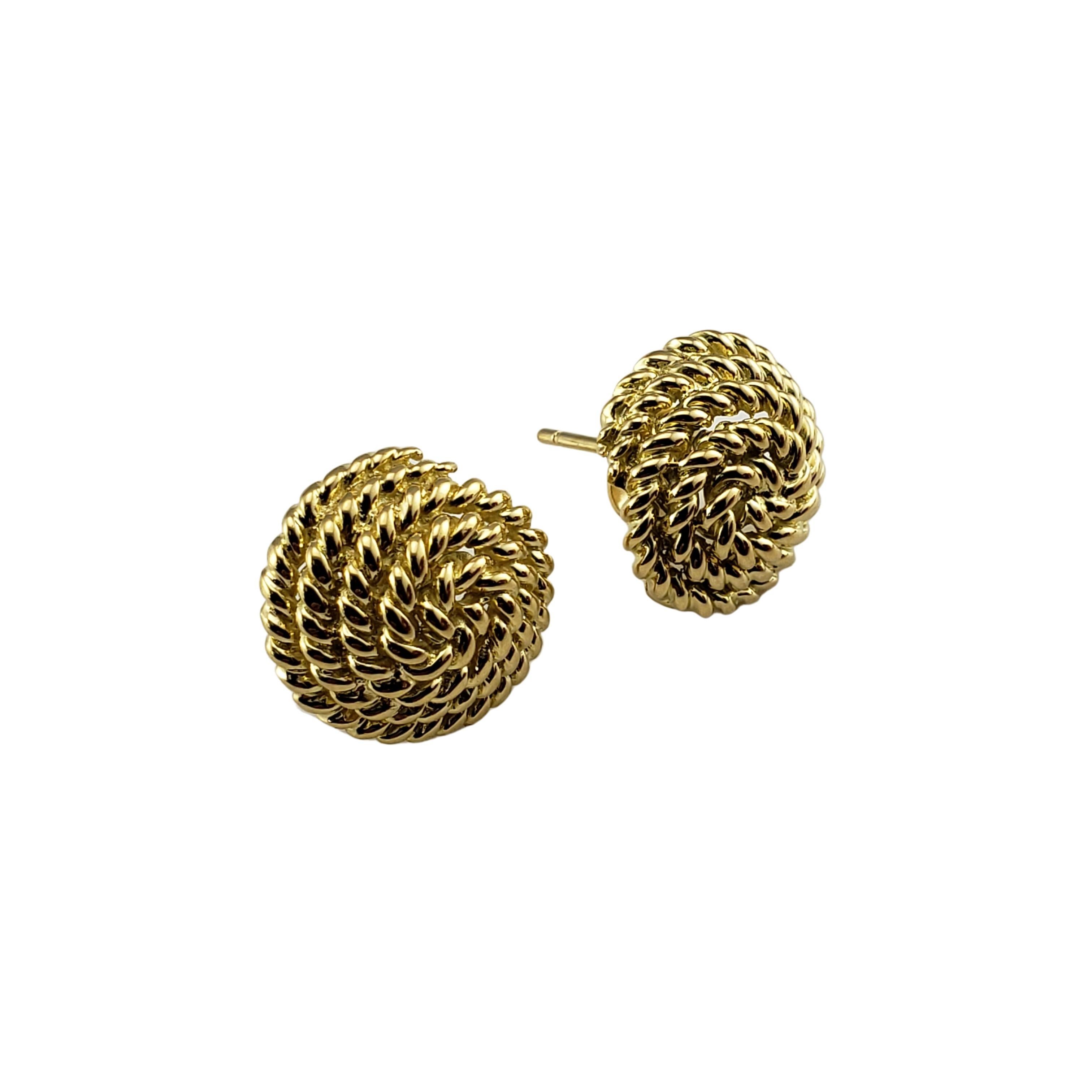 Vintage Tiffany & Co 18 Karat Yellow Gold Coiled Rope Earrings-

These elegant earrings are crafted in meticulously detailed 18K yellow gold by Tiffany & Co. Push back closures.

Size: 14 mm

Weight: 5.1 dwt. / 8.0 gr.

Hallmark: TIFFANY & CO