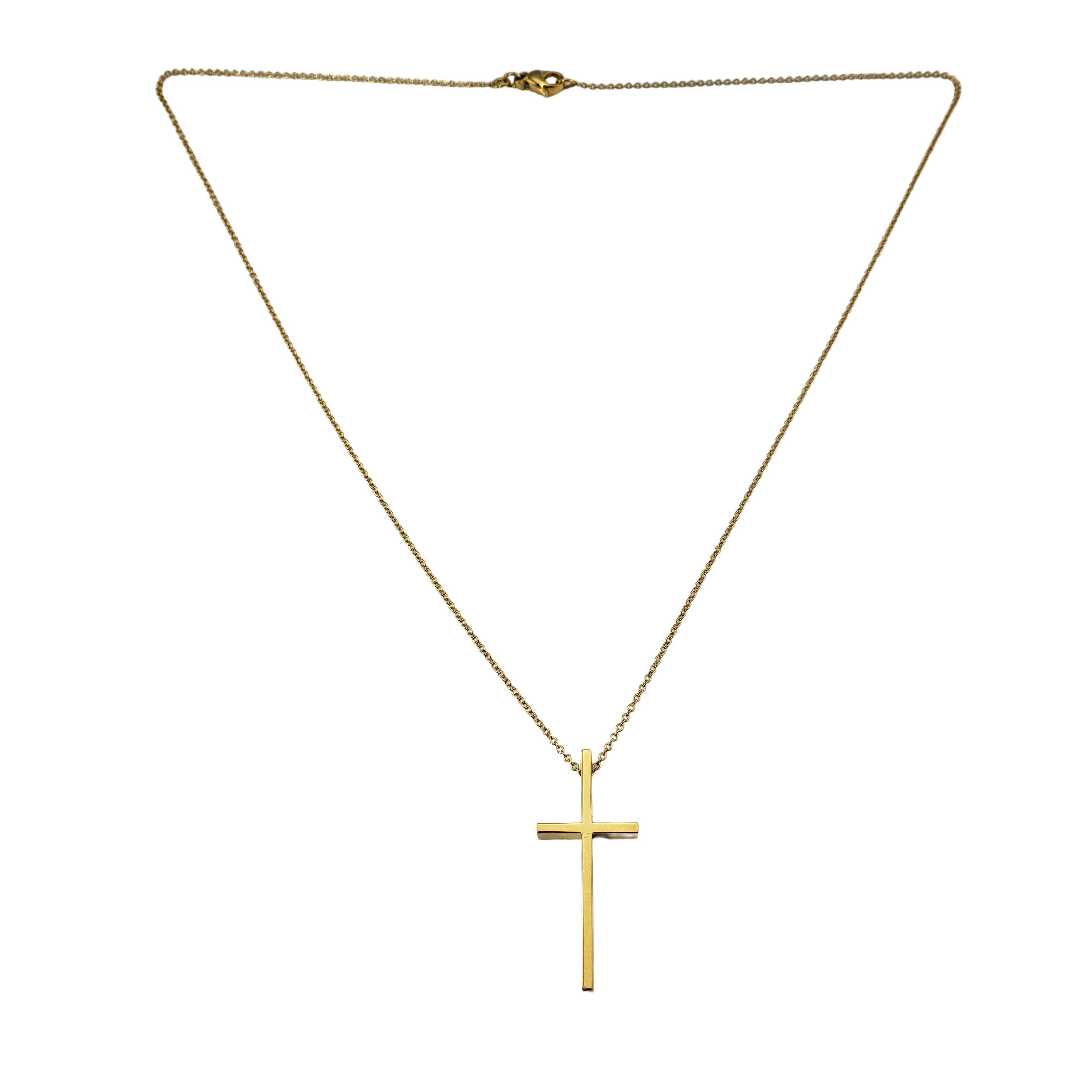 Vintage Tiffany & Co. 18 Karat Yellow Gold Cross Pendant Necklace-

This elegant Tiffany & Co. cross pendant is crafted in beautifully detailed 18K yellow gold; suspends from a classic 18K necklace.  

Size: 31 mm x 14 mm (pendant)
         17.5