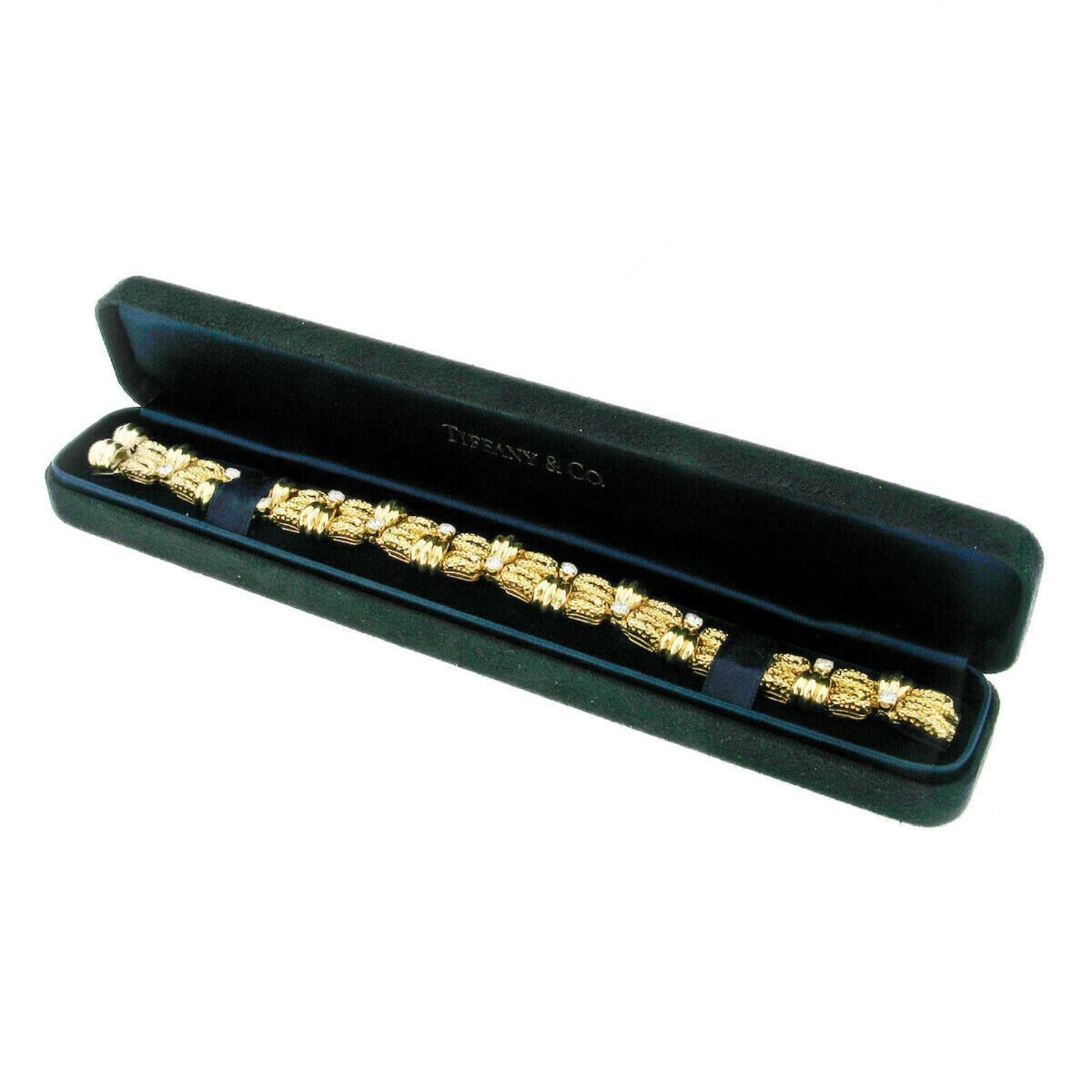 You are looking at an absolutely magnificent and uniquely designed vintage Tiffany & Co. bracelet hand crafted in solid 18k yellow gold. The bracelet was neatly hand assembled and further drenched with the finest quality diamonds throughout. The