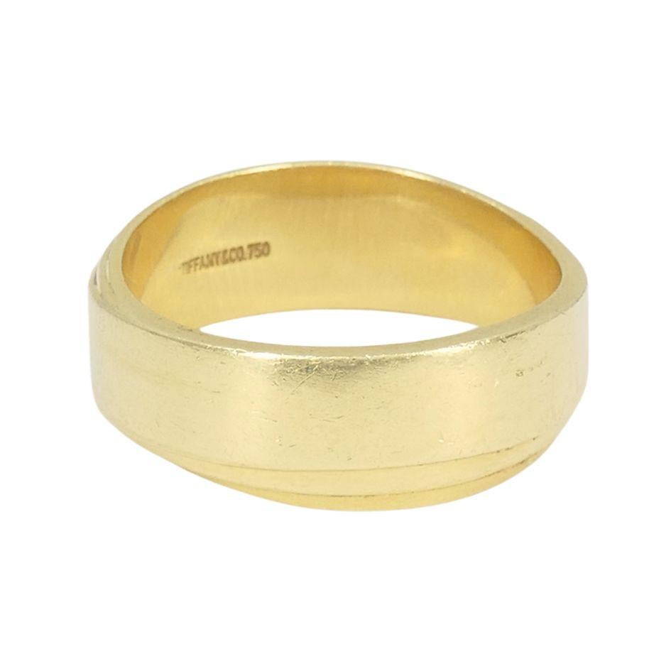 This vintage Tiffany & Co. ring from the 1980s is crafted in solid 18k yellow gold and designed to give the illusion of multiple layered bands. The smooth, sculptural form creates a dimensional look while maintaining a streamlined profile. The ring