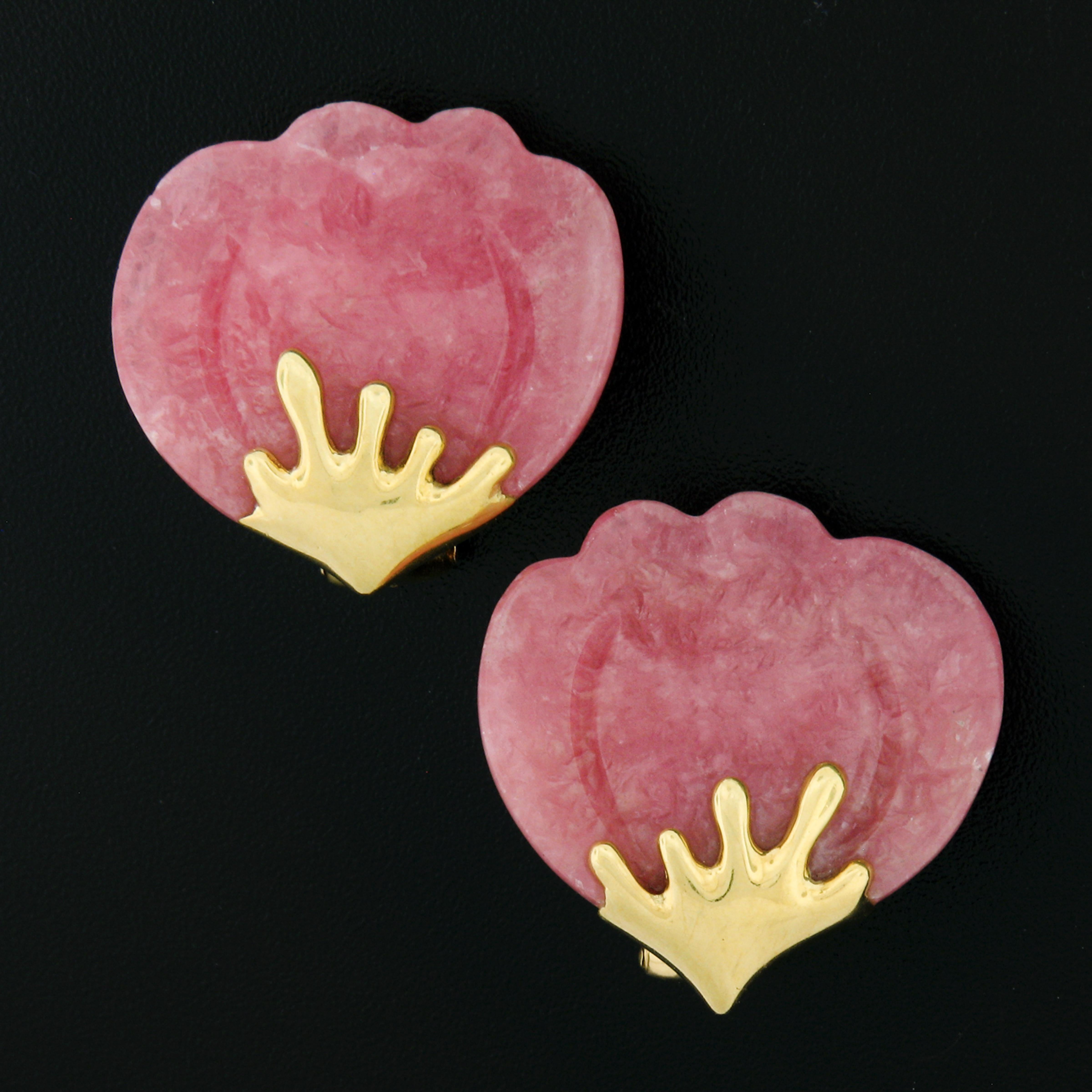 This beautiful vintage pair of Tiffany & Co. earrings features two gorgeous natural rhodochrosite stones which are well carved into a lotus petal flower design. The rhodochrosite display a pretty and very pleasant pinkish-red color and are nicely