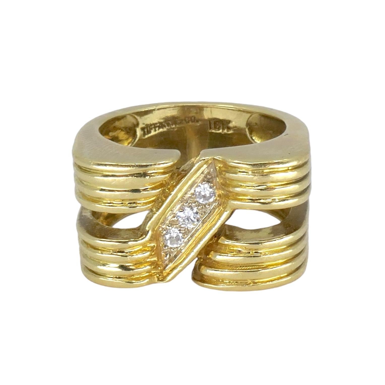 DESIGNER: Tiffany & Co.
CIRCA: 1970’s
MATERIALS: 18K Yellow Gold
GEMSTONE: 3 brilliant cut Diamonds
WEIGHT: 16.2 grams
RING SIZE: 7.5
HALLMARKS: TIFFANY & CO; 18K

The 