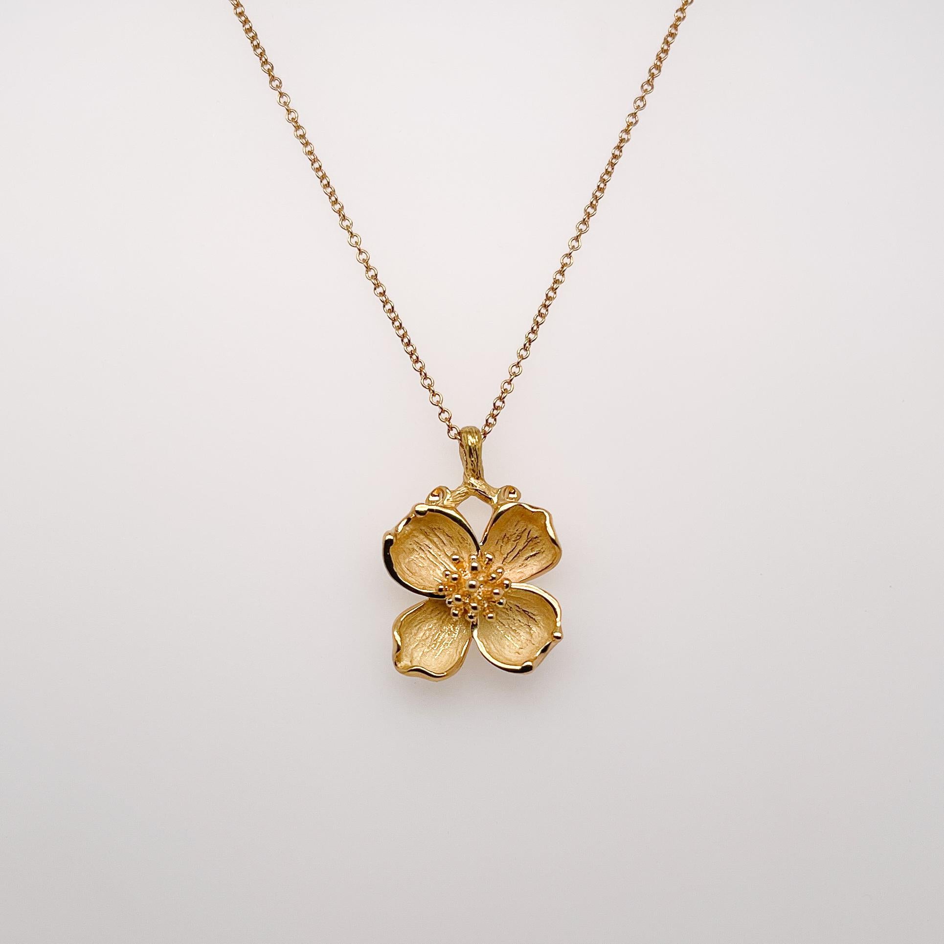 A dogwood flower pendant necklace.

By Tiffany & Co.

In 18k gold. 

Simply a wonderful, hard-to-find pendant by Tiffany & Co.!

Date:
20th Century

Overall Condition:
It is in overall good, as-pictured, used estate condition with some very fine &
