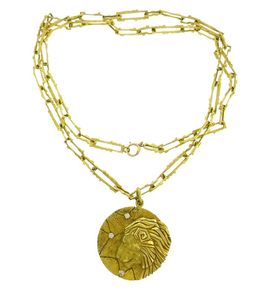 Signature Tiffany & Co. Leo Zodiac pendant necklace created in Italy in the 1970s.
Great gift for someone born between July 23 and August 22!
Made of 18 karat yellow gold and accented with three round brilliant cut diamonds (G-H color, VS clarity,