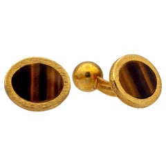 Gemelli vintage Tiffany & Co. in oro 18 carati con occhio di tigre e fondello a sfera fisso, anni '60 ca.