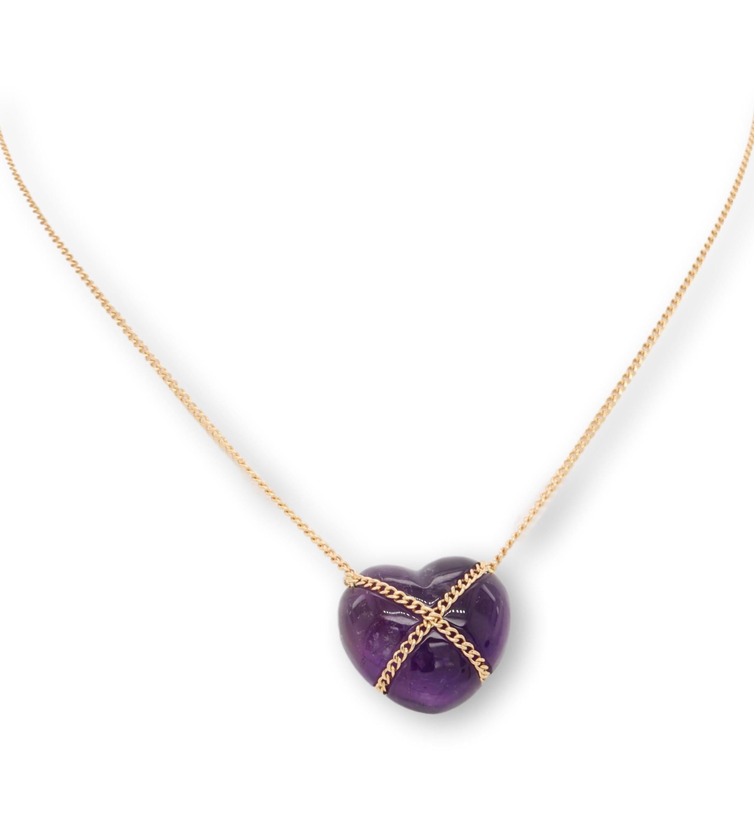 Tiffany & Co. vintage pendant necklace finely crafted in 18 karat rose gold with a cabochon amethyst heart pendant with a flat bottom measuring 13mm hanging off a delicate 18