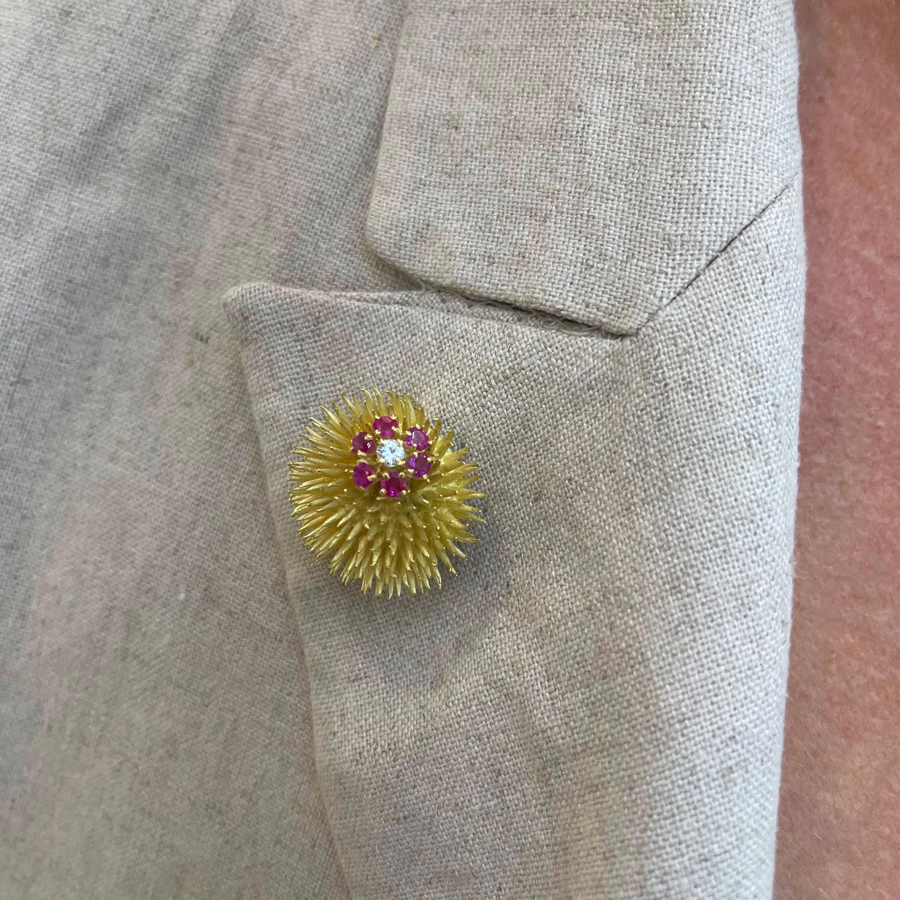 Brand: Tiffany & Co.

Gender: Ladies

Metal Type: 18K Yellow Gold

Diameter: 1.00 inches

Weight: 17.02 grams

18K Yellow Gold Diamond and ruby vintage brooch. The metal was tested and determined to be 18K yellow gold. The 
