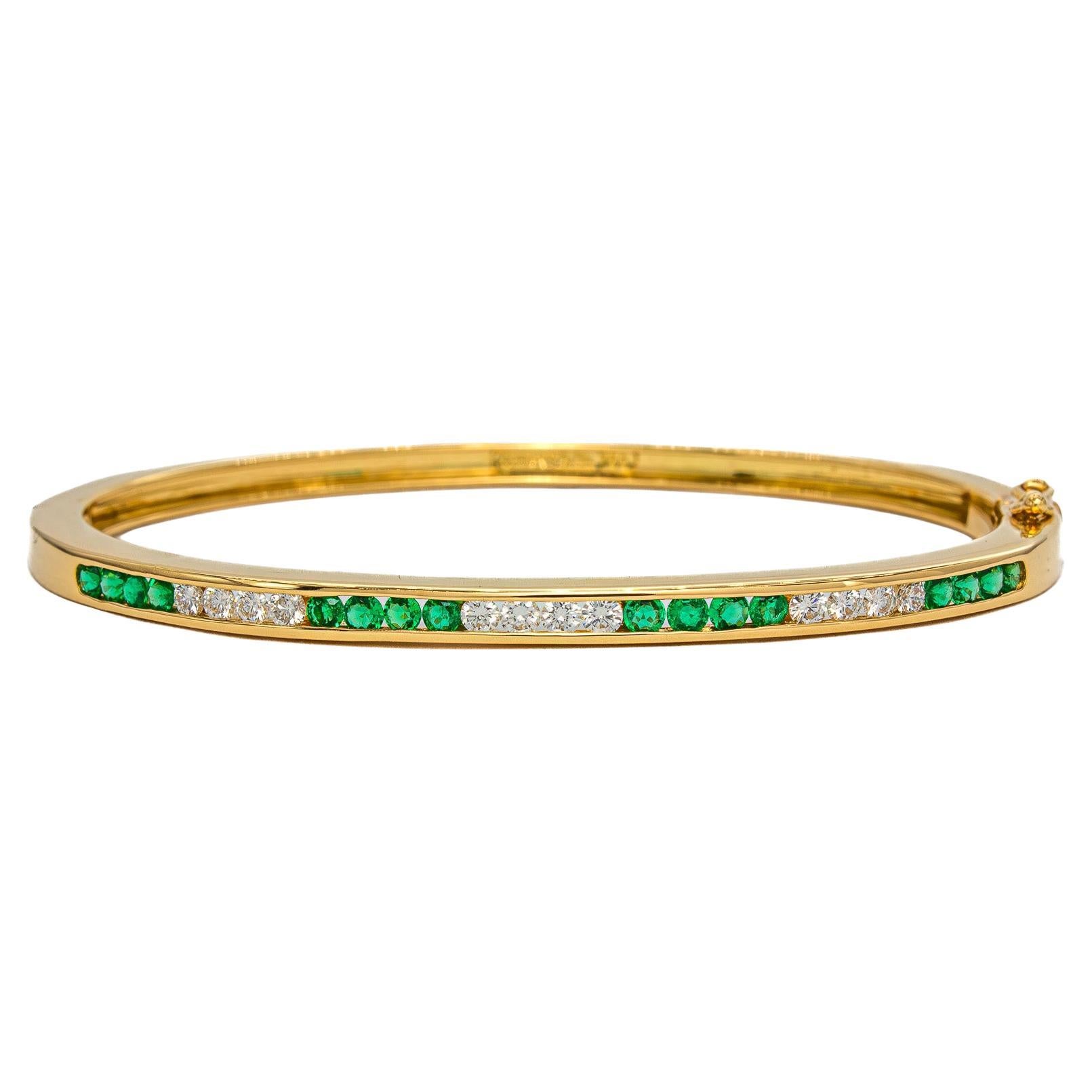 Vintage Tiffany
Co. 18K Yellow Golding Co. Emerald and Diamond Bangle in