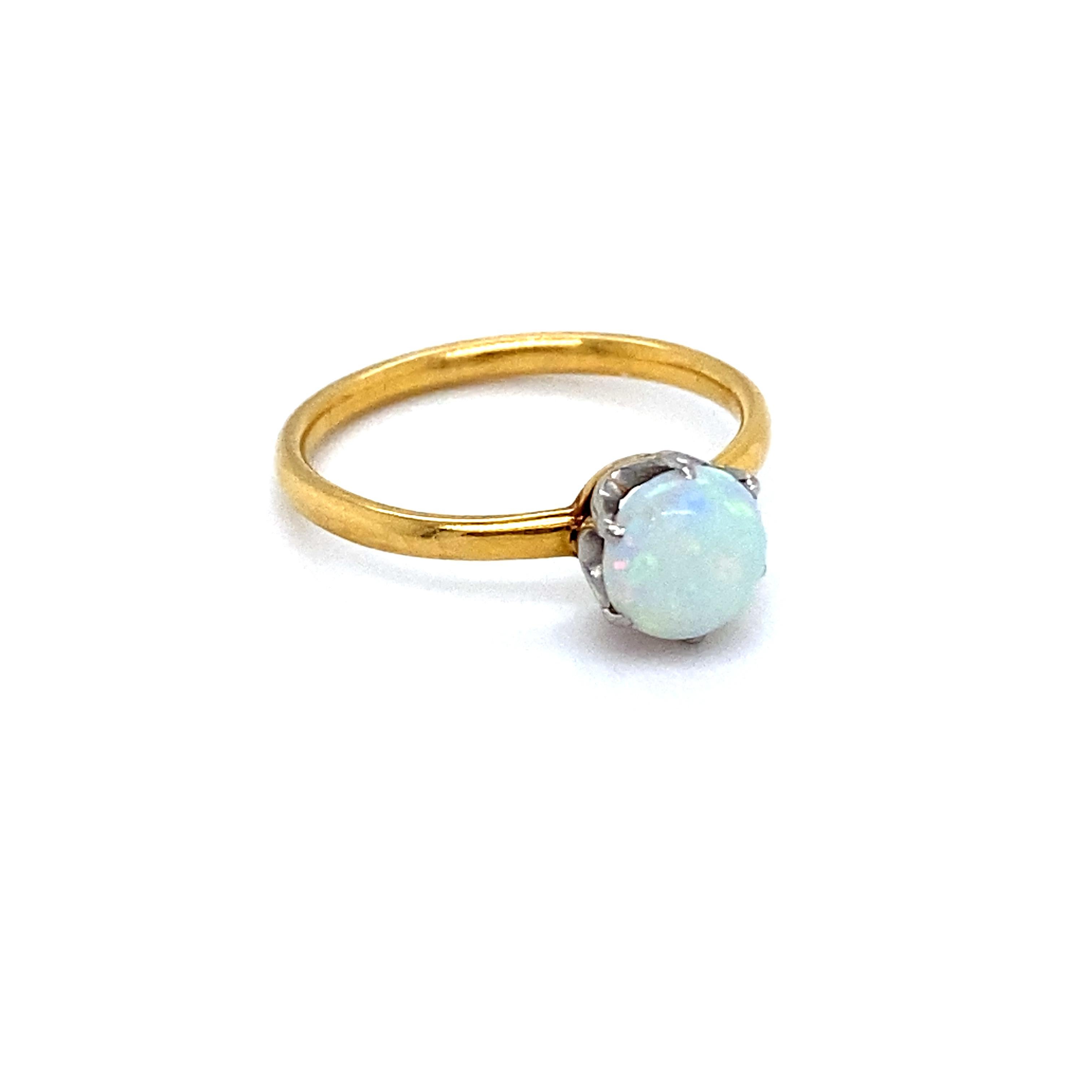 This Vintage Tiffany & Co 18K Yellow Gold Opal Solitaire Ring Engagement Ring is a beautiful, classic solitaire design that Tiffany is known for! Crafted in 18K Yellow Gold, the design features their sweet buttercup setting with a wonderful Oval