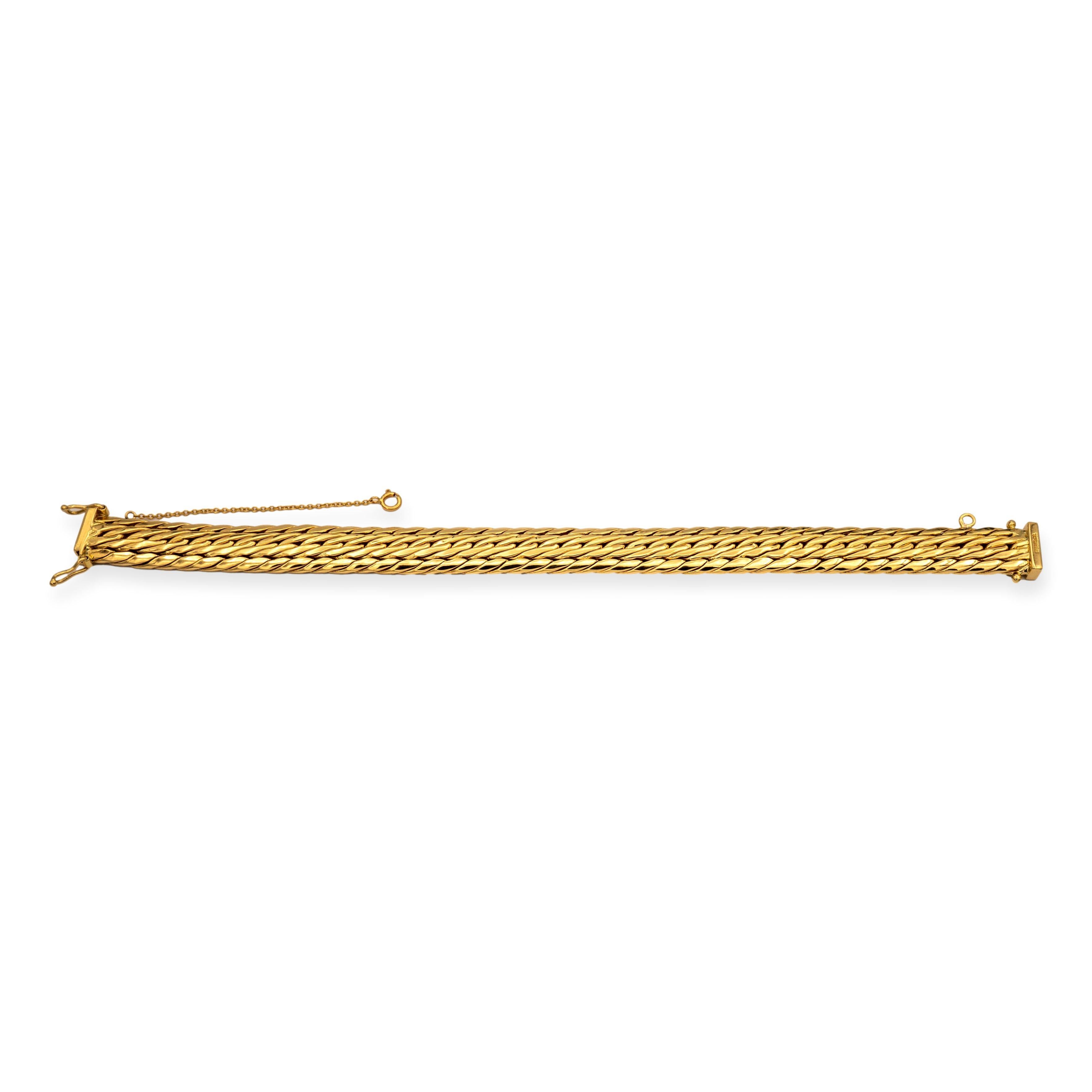 Vintage Tiffany & Co Gold Weave Bracelet. With its intricate 10.1mm wide design, it's a testament to both craftsmanship and style. Measuring 7.25 inches in length, this piece is adorned with a secure slide closure for effortless wear. For added
