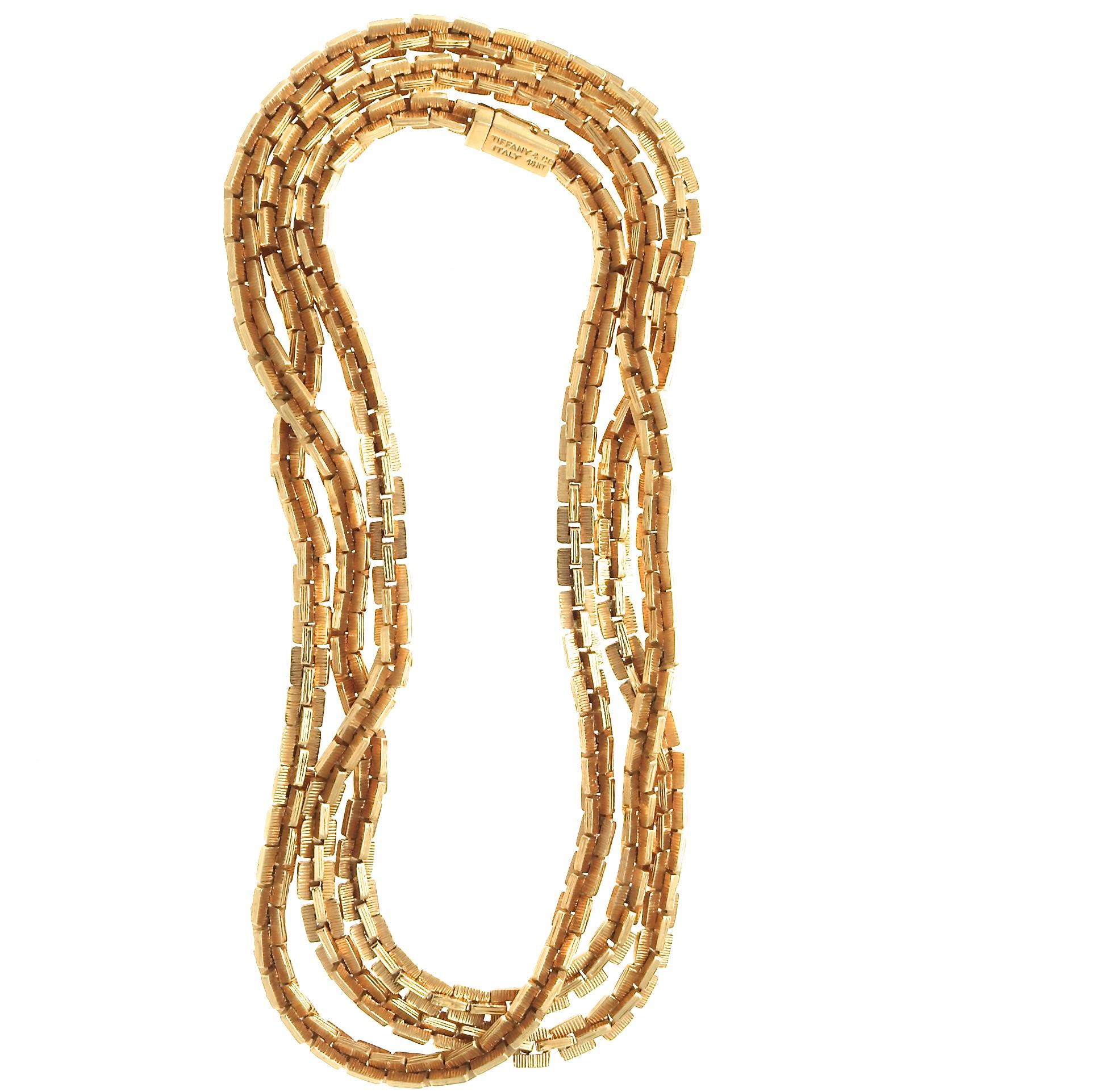 A chain is never just a chain, especially when it's made by Tiffany & Co. With its own unique design of interlocking components, this substantial 18 karat gold neck piece is 37 inches long and makes a major statement in lustrous gold. No layering