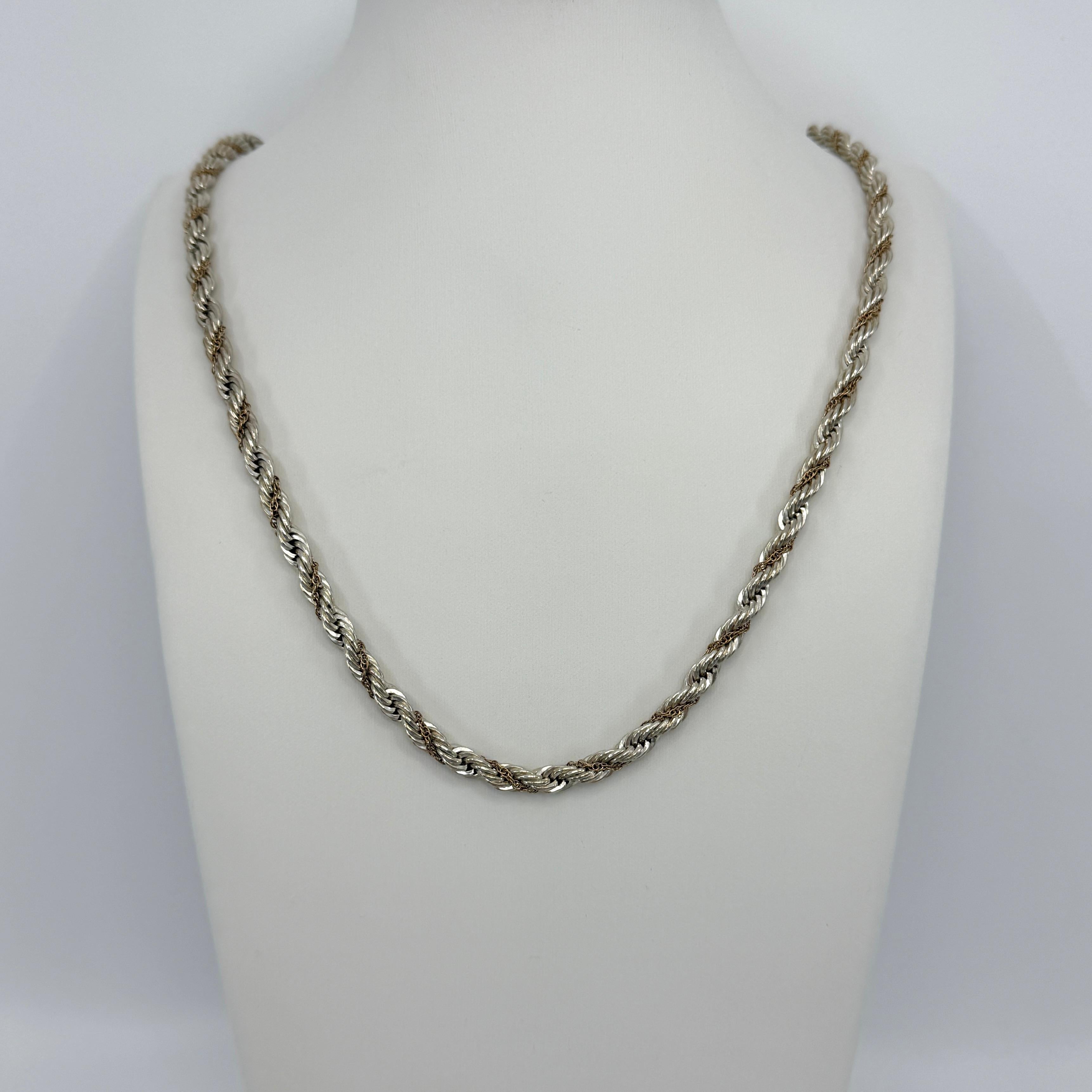 Vintage Tiffany & Co. 925 Silver & 14k Yellow Gold Rope Chain Necklace.

A beautiful and rare authentic Tiffany & Co chain necklace featuring a sterling silver rope design with intertwining 14k yellow gold chain.

Chain measures 60cm and weighs