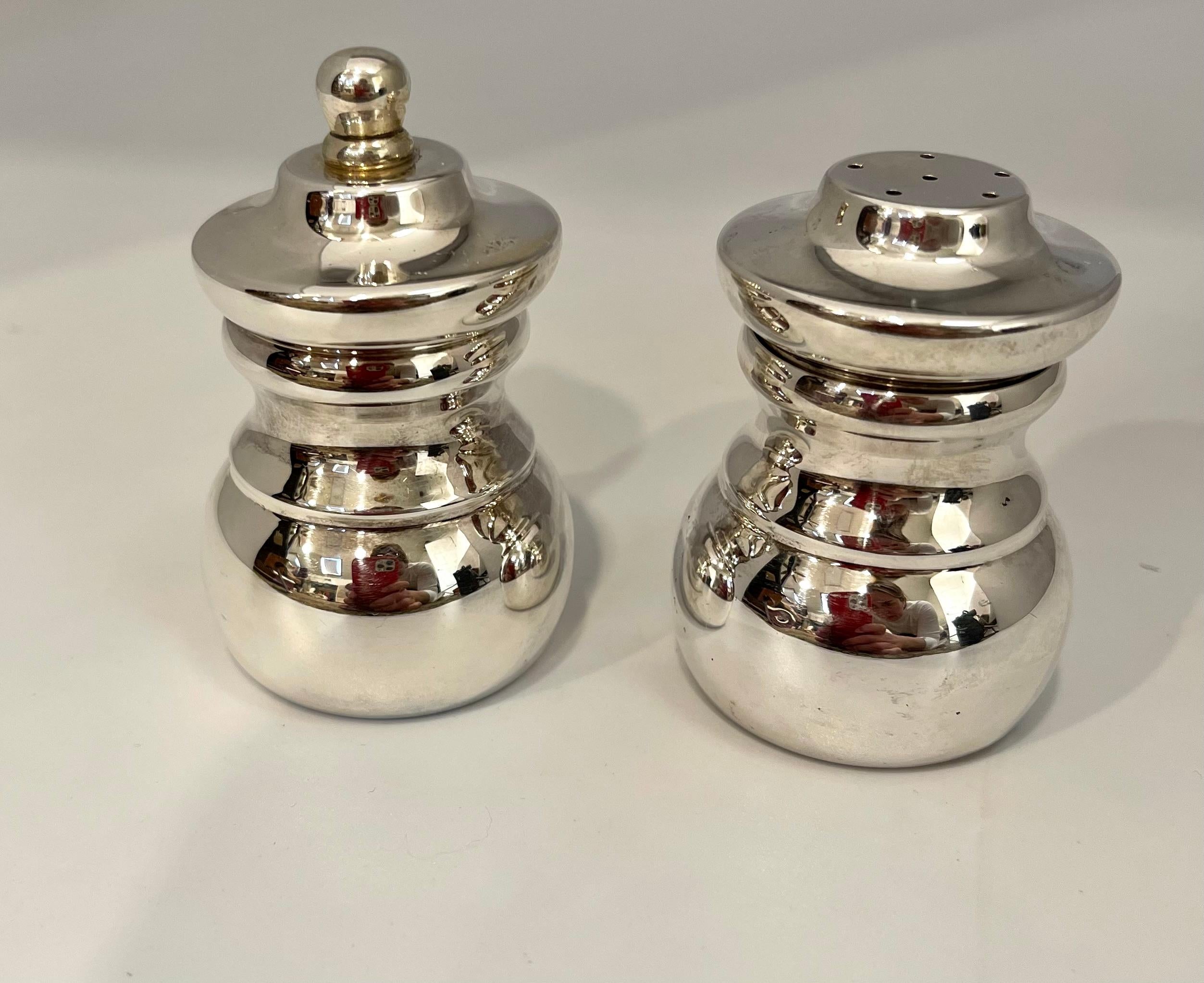 Two-Piece Tiffany & Co. Sterling Silver Salt & Pepper Set 174 Gm
Very Exclusive 
A Tiffany & Co maker's sterling silver Salt & Pepper set
It is  Signed and Engraved T & CO and made in Italy
This set is in excellent condition. Stunning!
Total weight