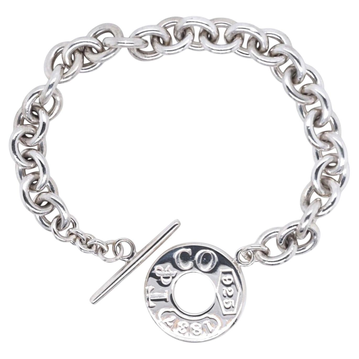 Vintage-Armband von Tiffany & Co. aus 925er Sterlingsilber mit 1837er-Anhängern und Knebelverschluss, 7"