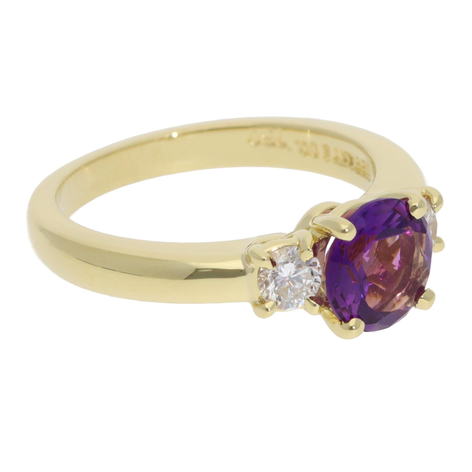 A beautiful vintage Tiffany & Co. amethyst and diamond three-stone ring set in 18k yellow gold.

From the discontinued Tiffany & Co. collection, the ring is composed of a central round mixed-cut amethyst and 2 round brilliant-cut diamonds on the