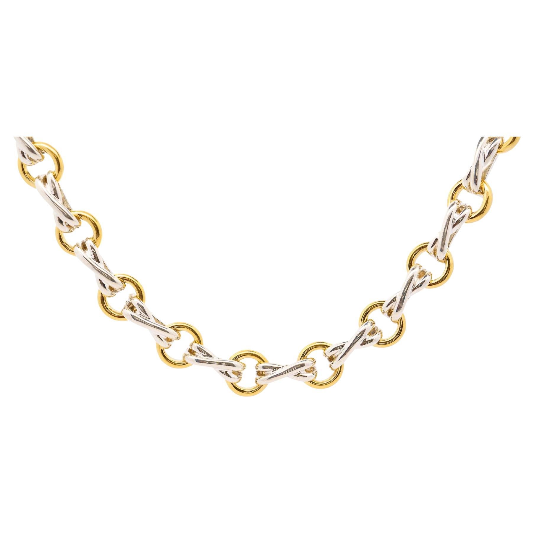 Vintage “X/O” Tiffany & Co and Paloma Picasso Dog Bone 18K Gold and Silver Link Chain Necklace. Made with all original parts and in excellent condition. 

Fixed with strong links that offer excellent coverage on the neck. A chain necklace that is