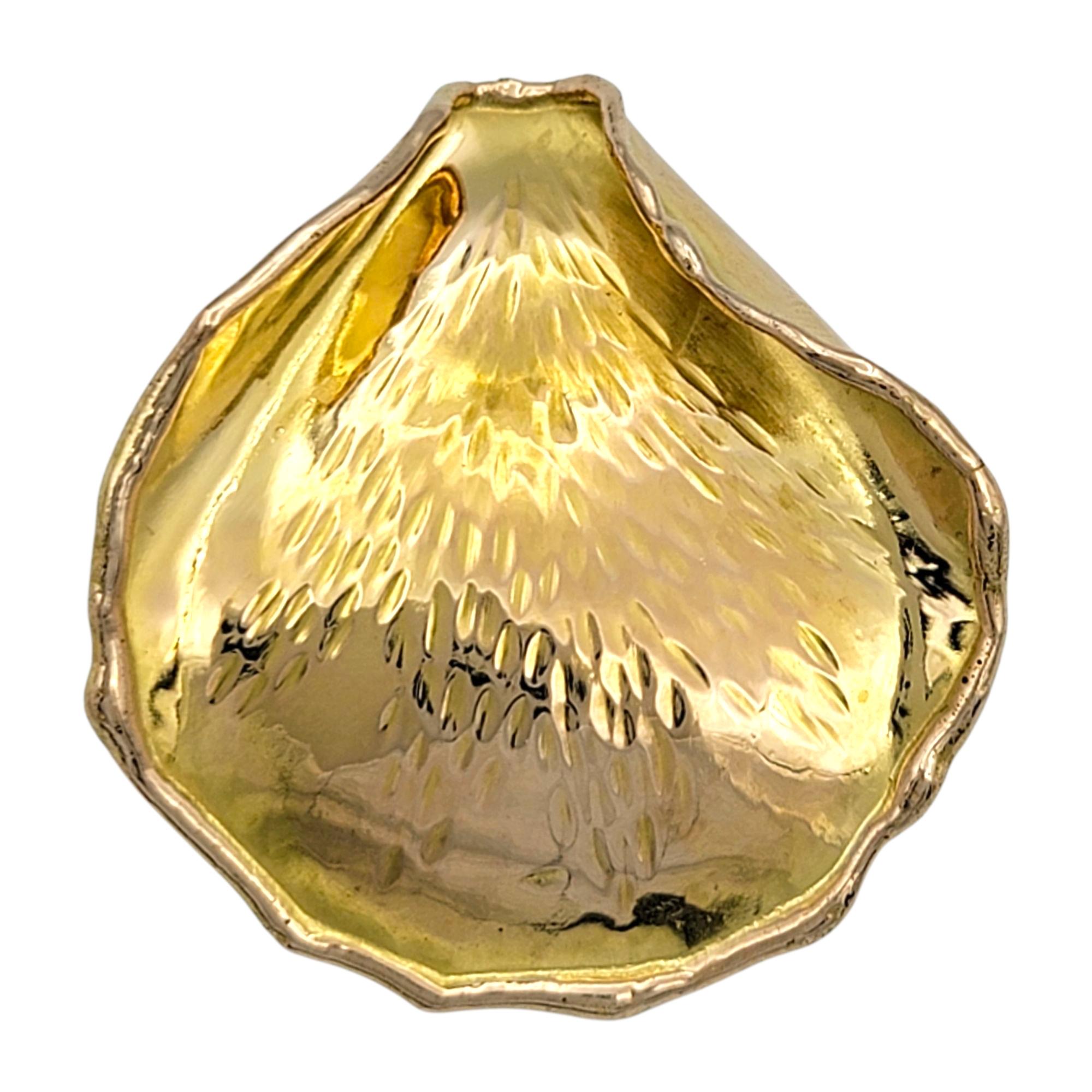 Crafted in 18 karat yellow gold, this vintage Tiffany & Co. brooch / pendant is an iconic design by Angela Cummings from 1979. The piece is shaped like a delicate rose petal, sculpted with gentle undulations and an organic form that captures the