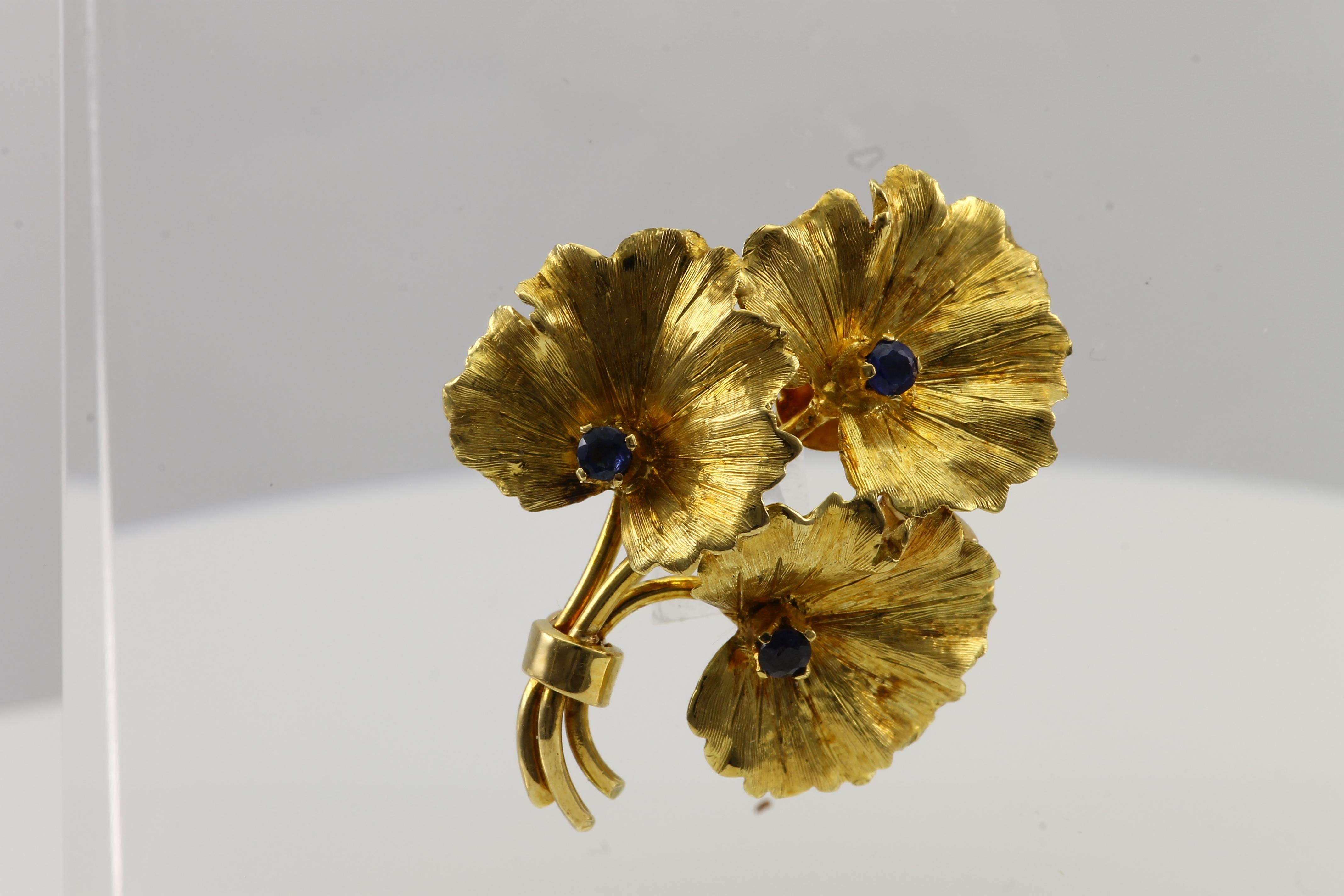 Vintage Tiffany & Co Flower Bouquet with 3 Blue Sapphire Round set in 18K Yellow Gold. Can be worn as a brooch or a pendant.

Chain not included.